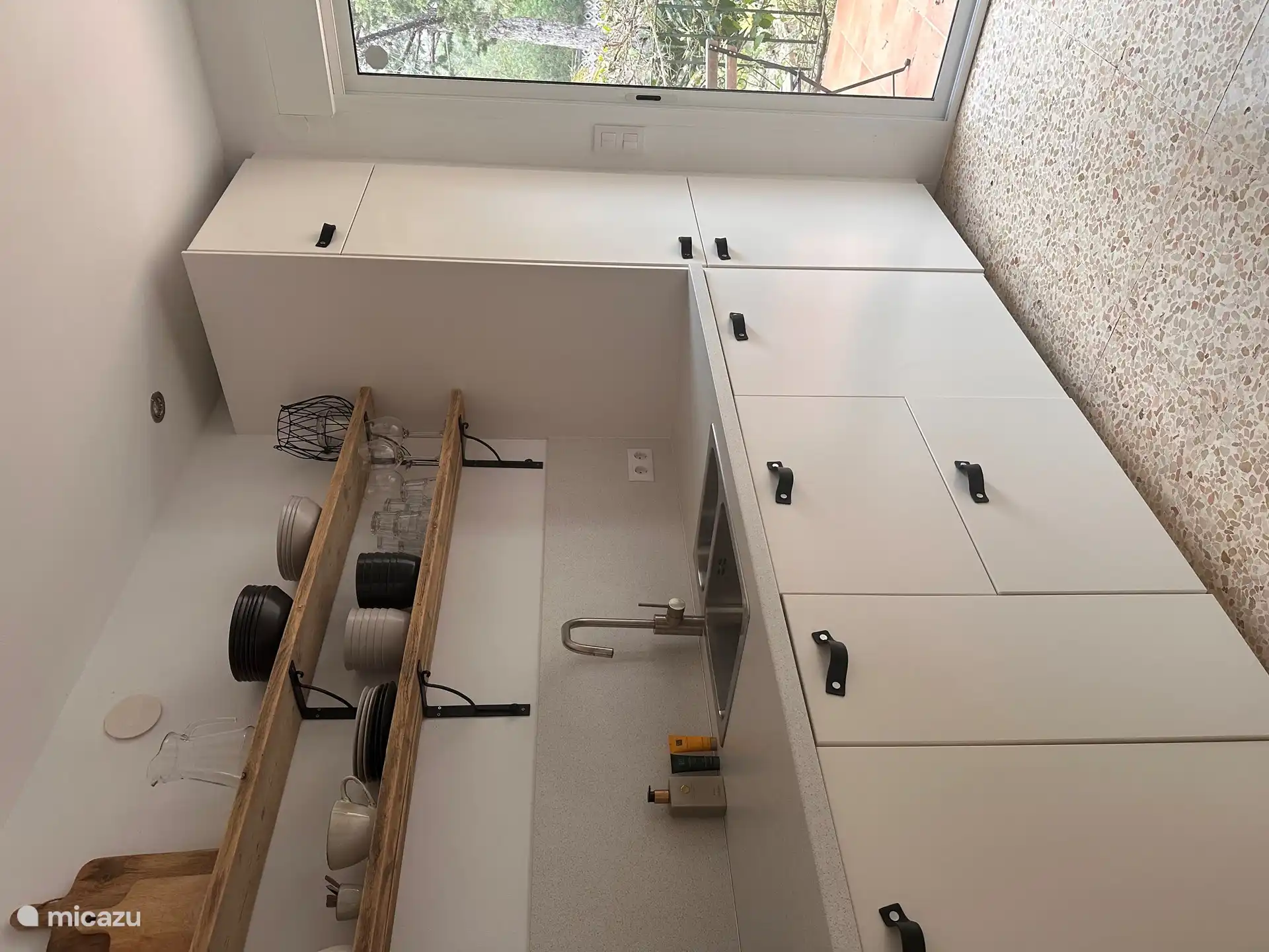 The kitchen, with sliding doors to the terrace