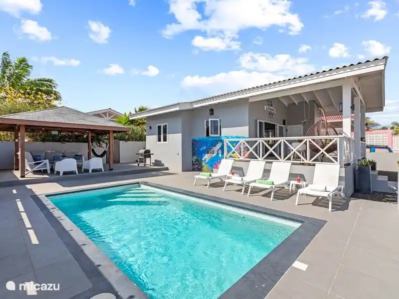 Pool deck equipped with 4 comfortable sun loungers