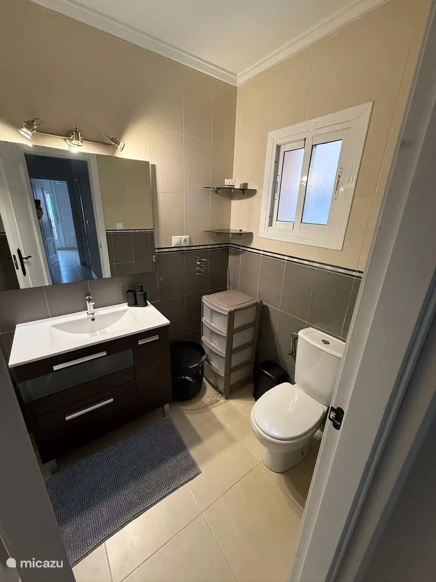 Bathroom upstairs, with bath, shower, toilet, sink, hair dryer, bathroom heater.