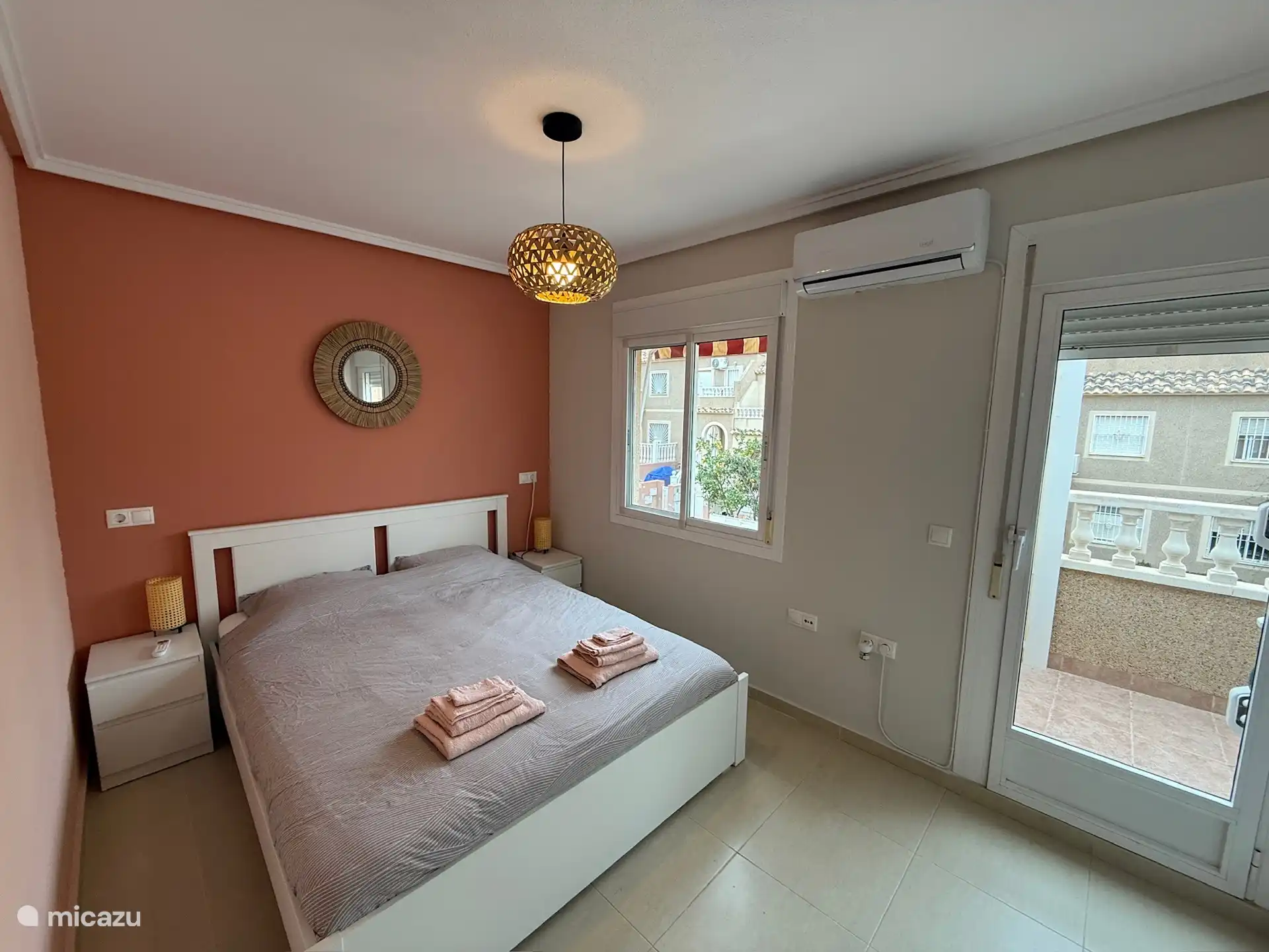 Bedroom Terra, located on the 1st floor. Has a double bed (160x200), built-in wardrobe and air conditioning. Also has a small balcony.