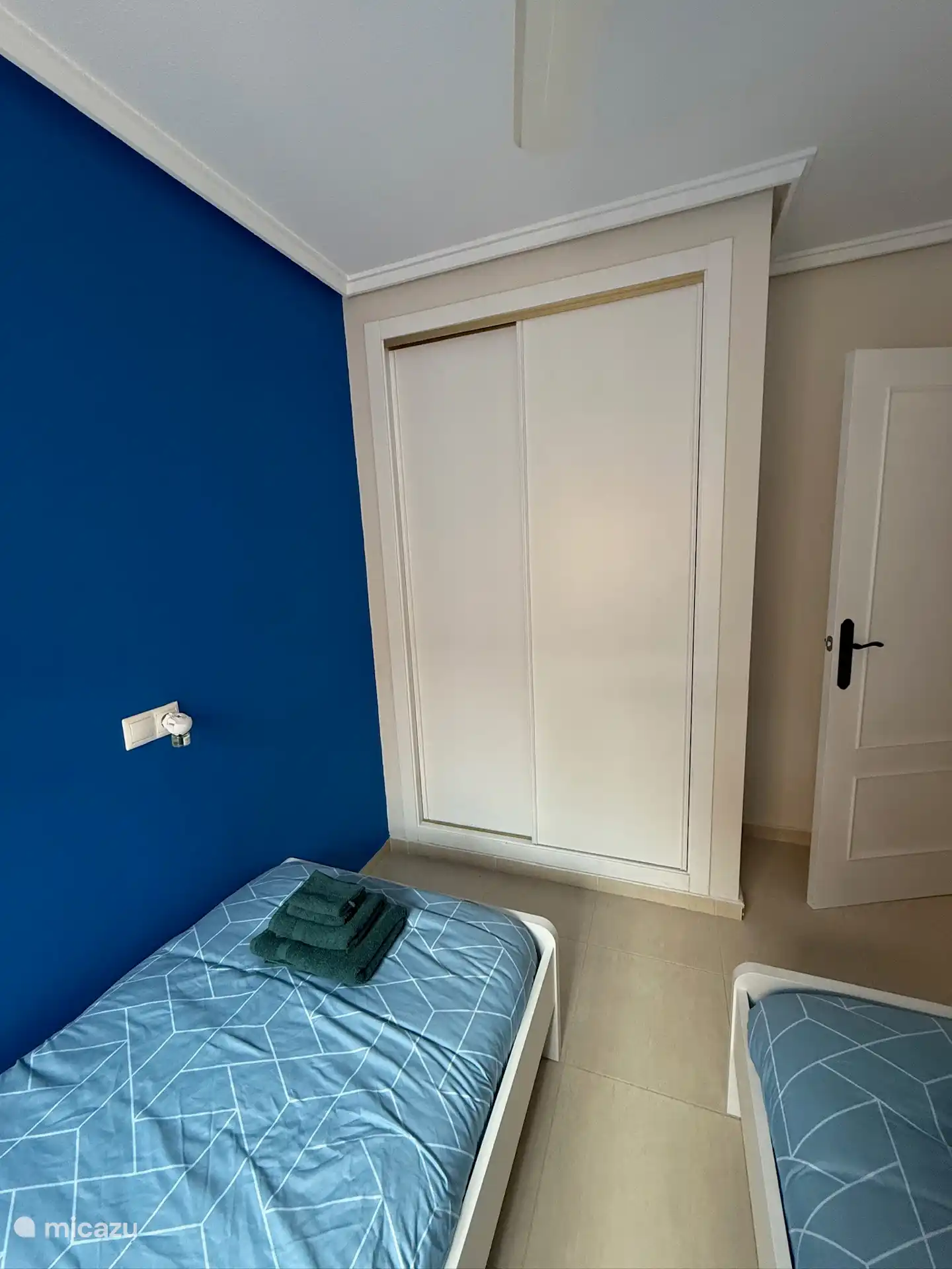 Fitted wardrobes with ample space. has clothes hangers, shelf and chest of drawers