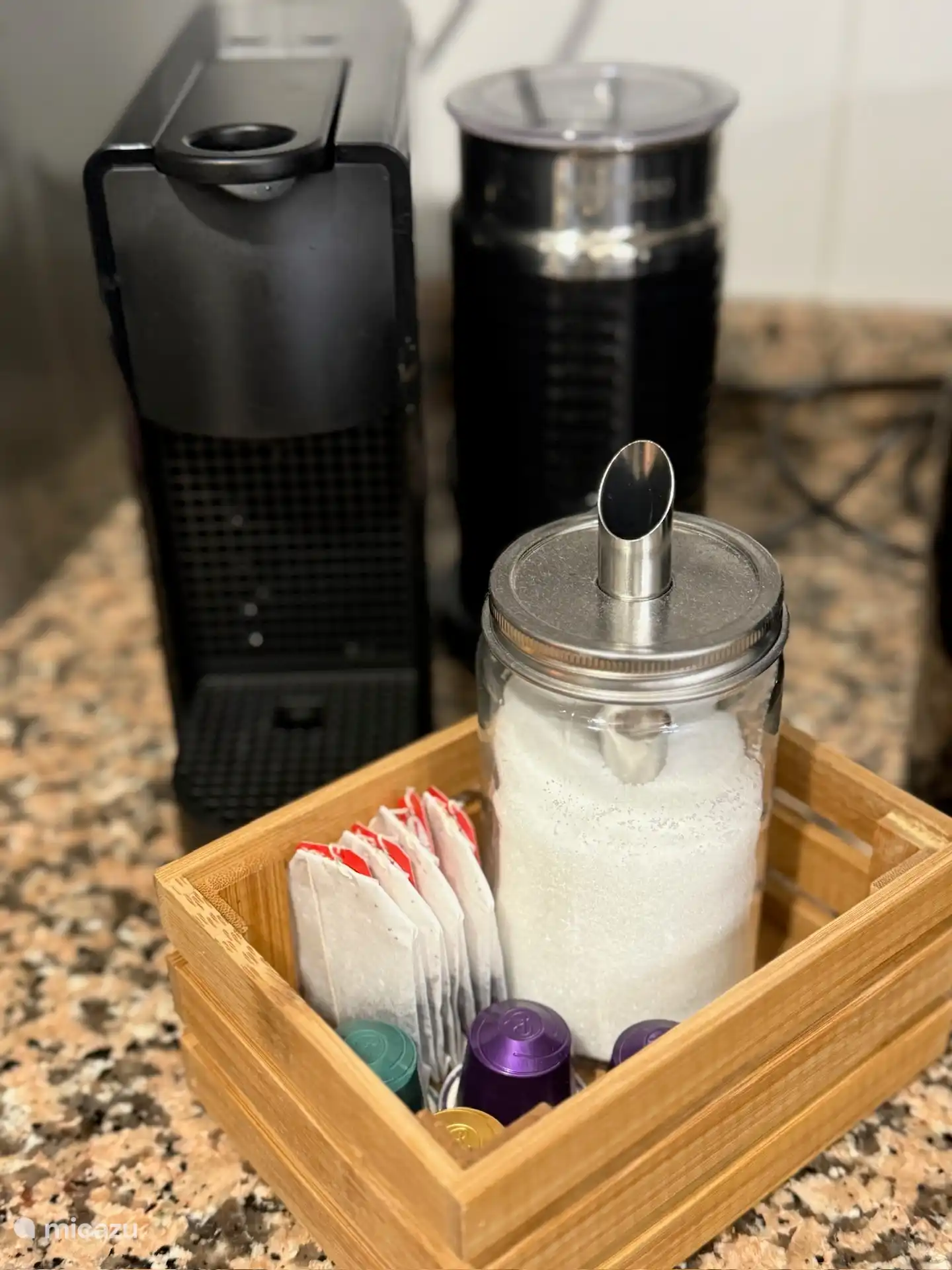 Nespresso machine with milk frother and coffee/tea