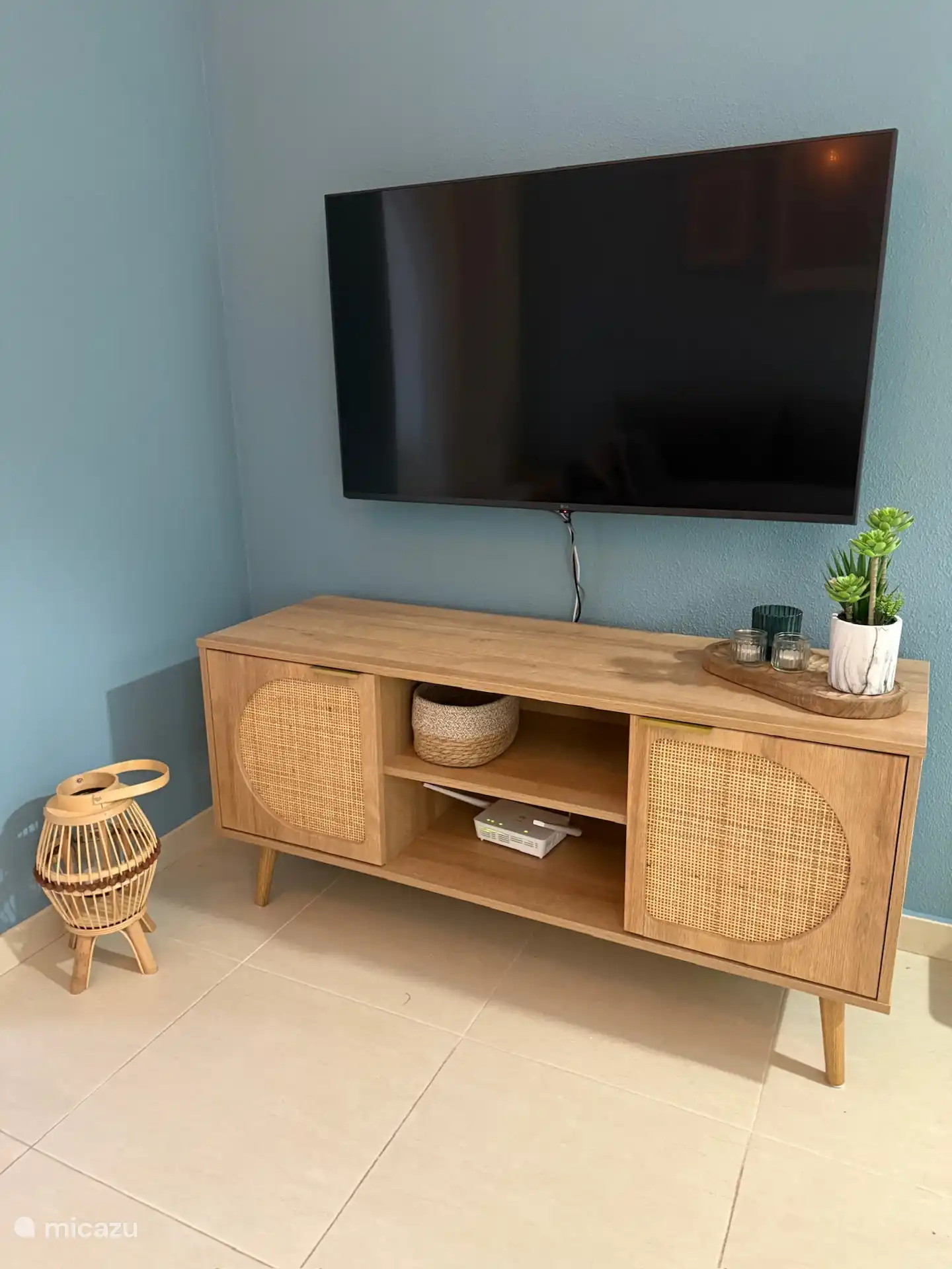 Smart TV and TV cabinet with games for young and old.