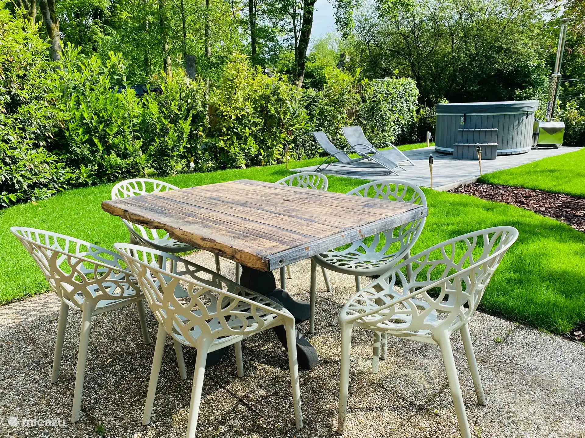 Nice dining table in the garden with 6 dining table chairs