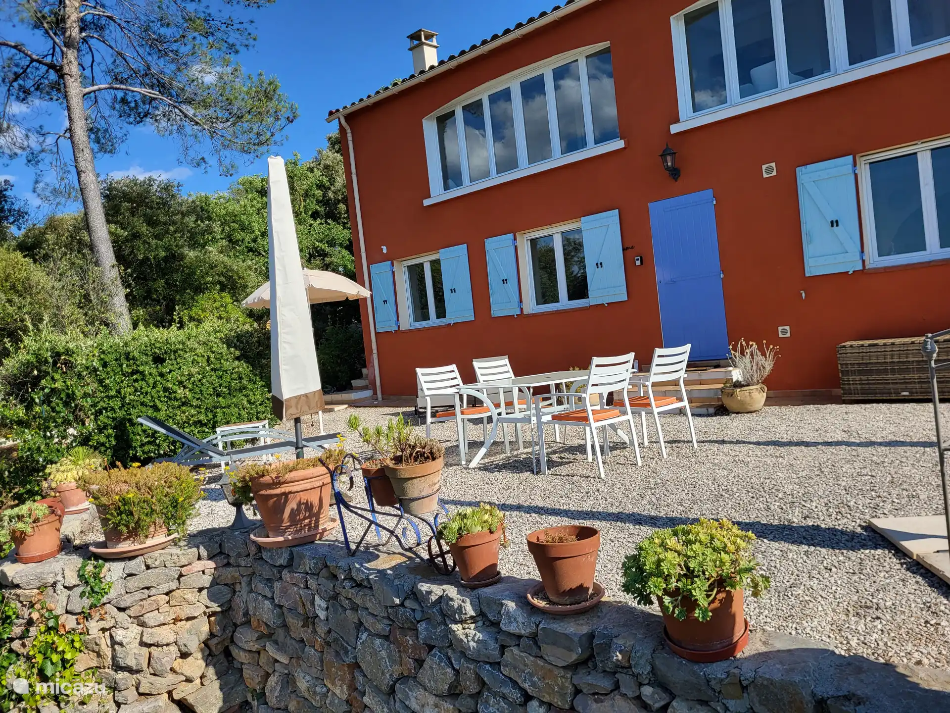 terrace downstairs with four-person dining table