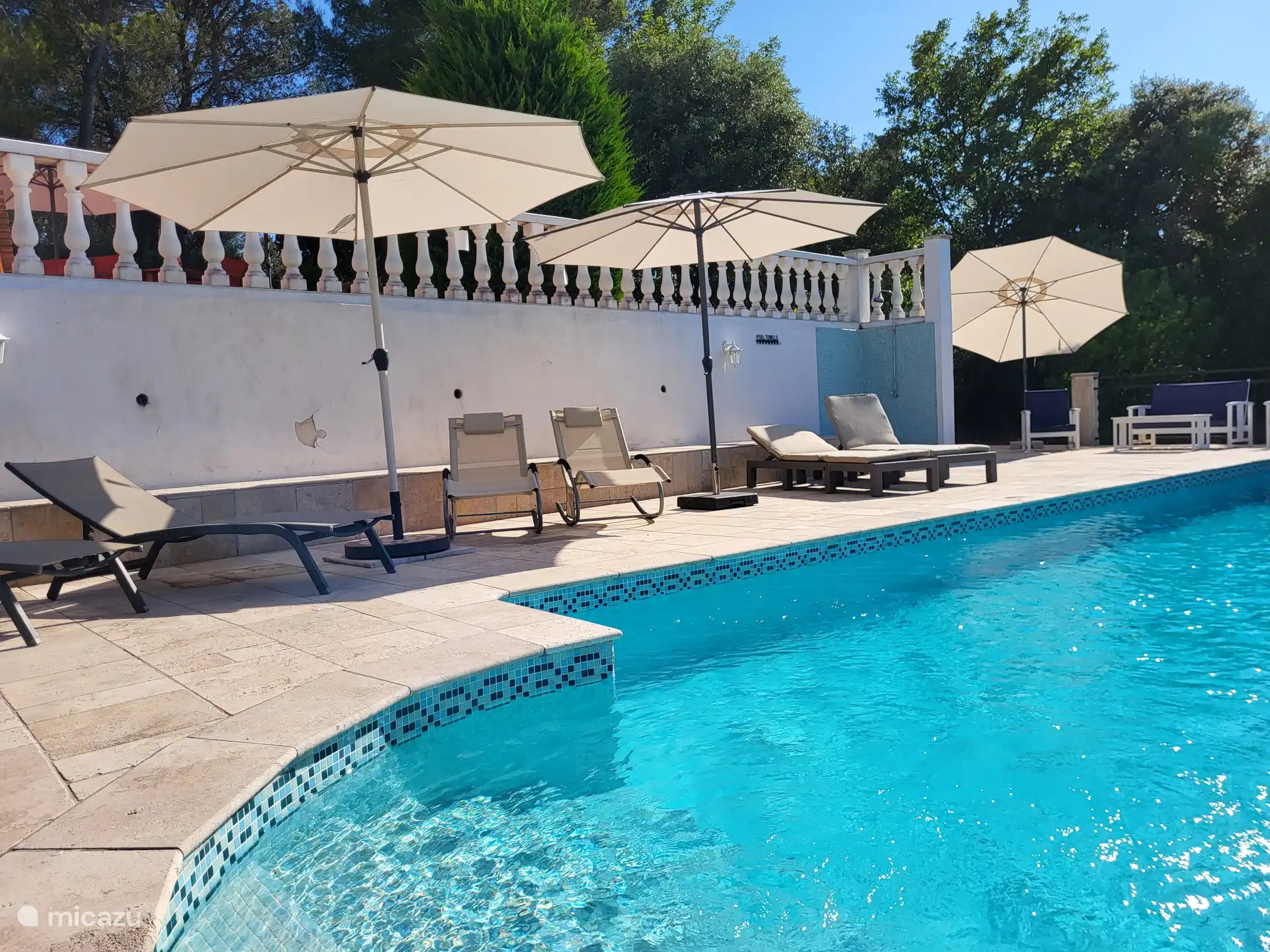 11 sunbeds and 7 umbrellas by the pool and terrace below