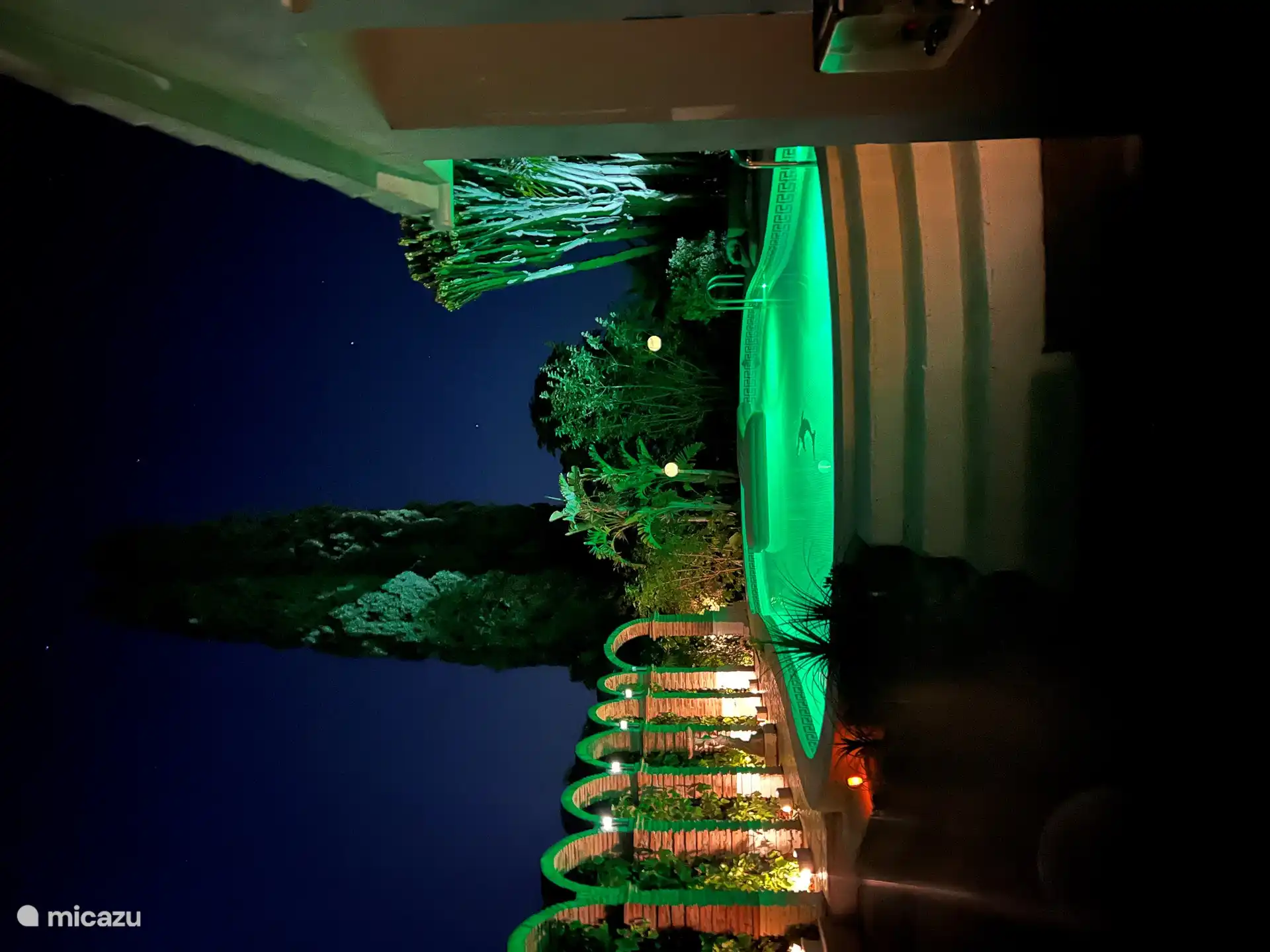 Beautiful evenings under the stars with different color lighting of the pool