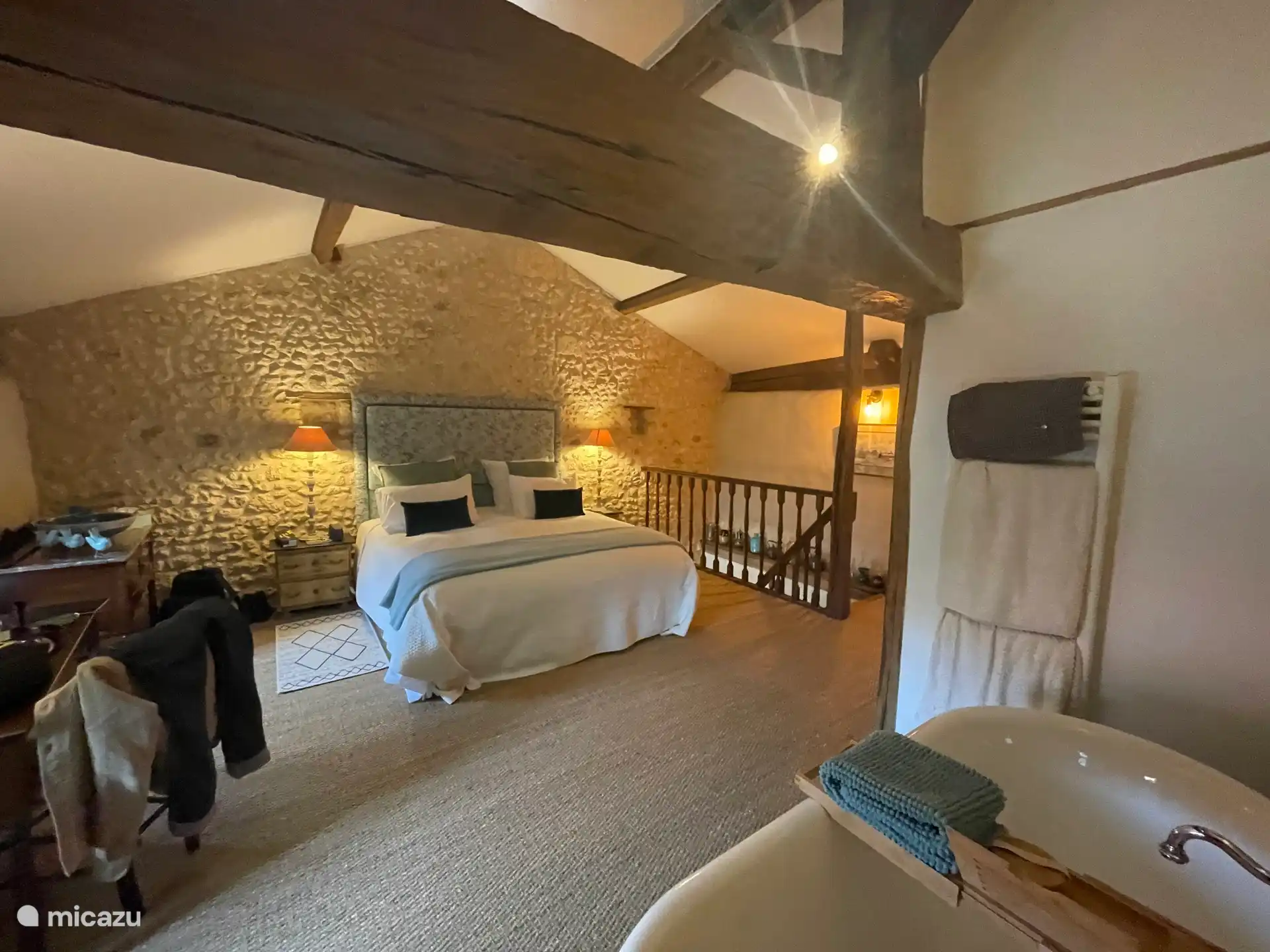 Courtyard cottage bedroom with roll top bath 