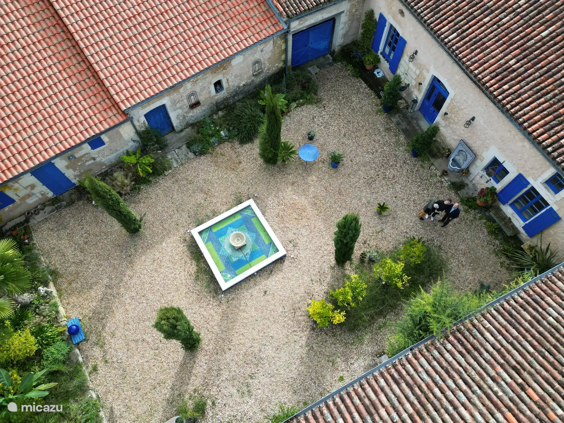 Internal private courtyard with open dining area and courtyard cottage 