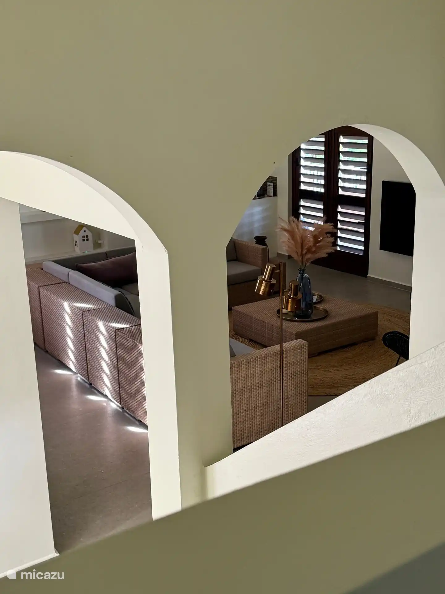 View of living room from landing bedrooms upstairs.