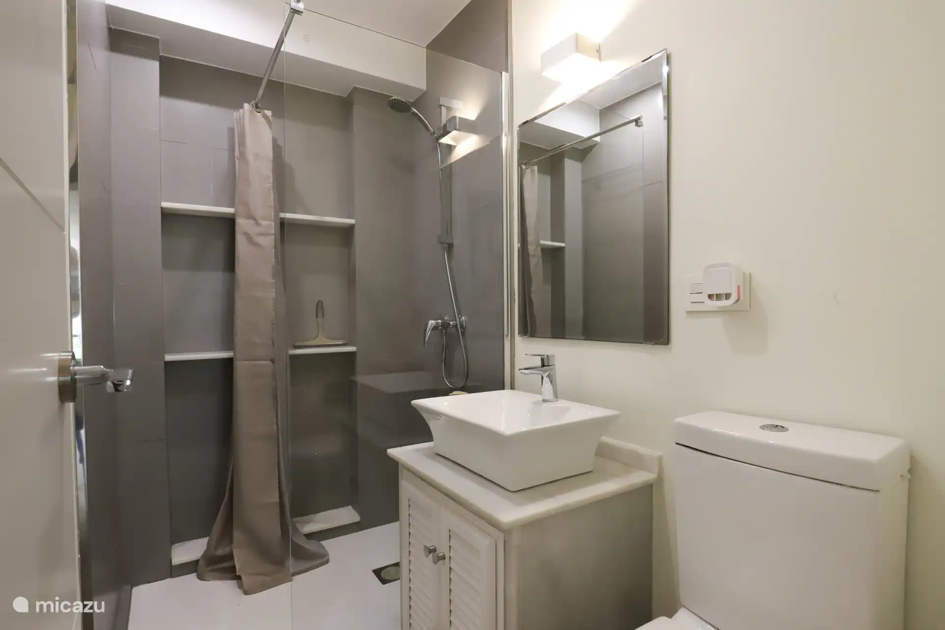 Bathroom 1, shower, sink, toilet.