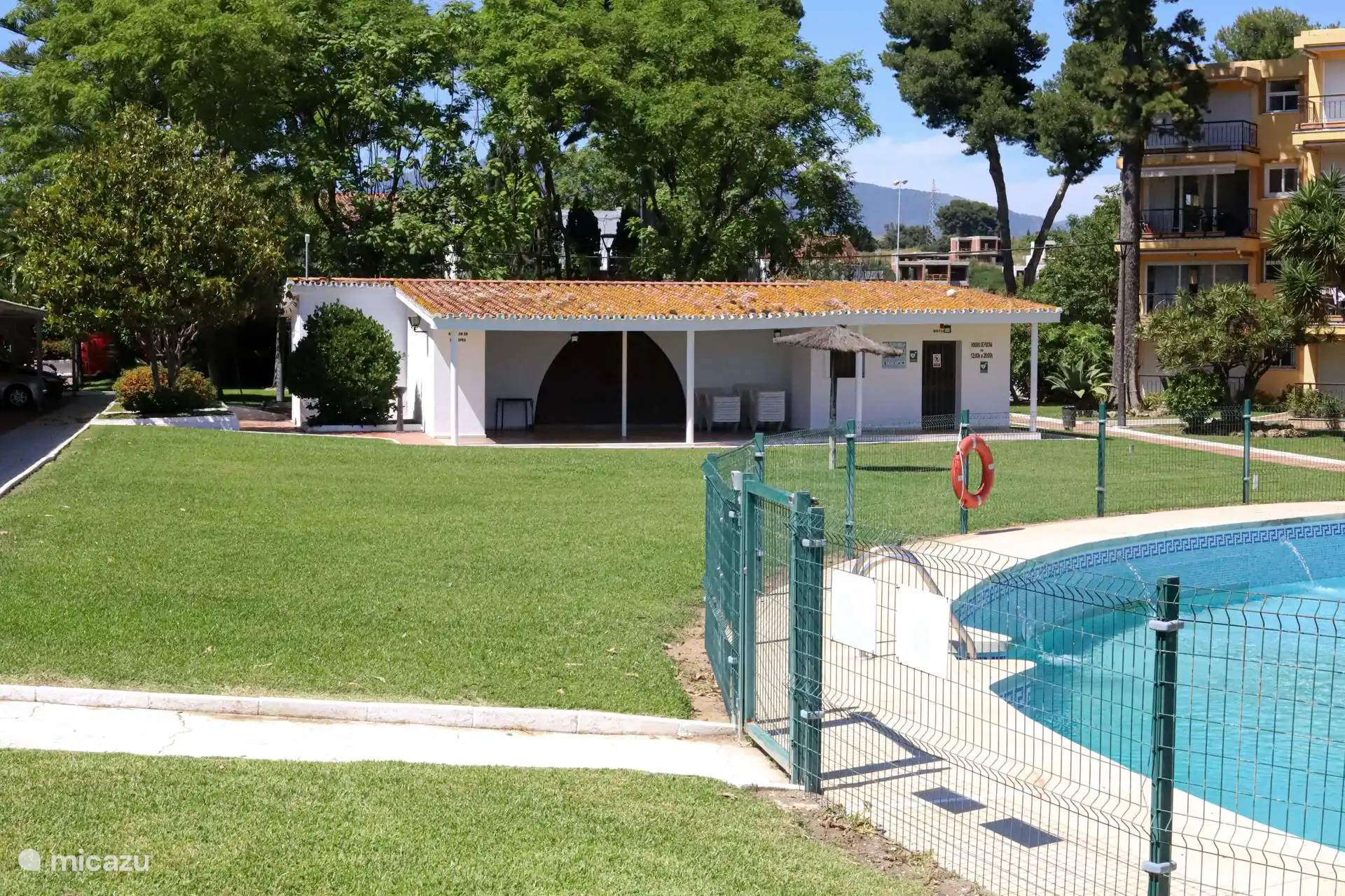 Large community lawn with swimming pool 