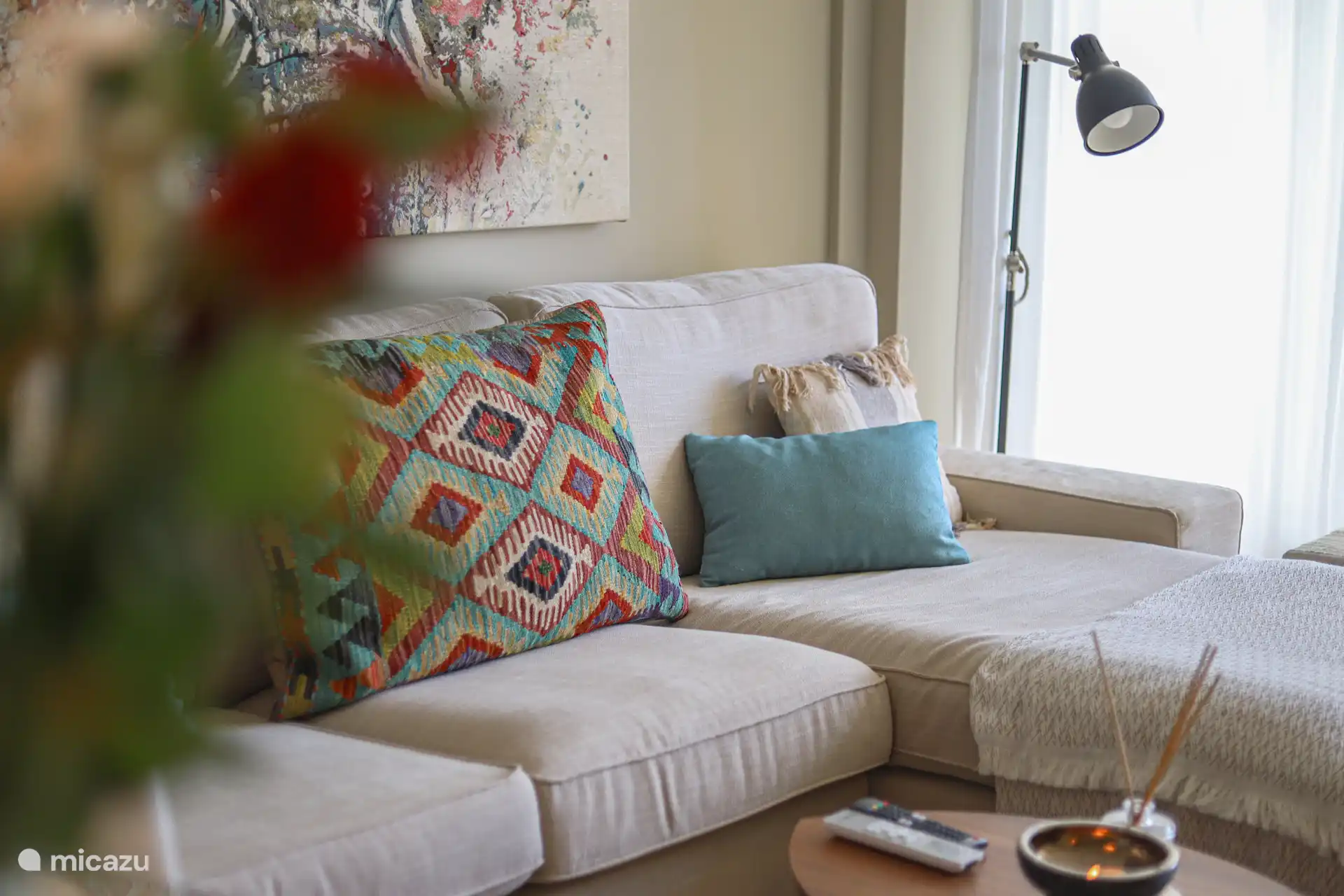Cozy sitting area with colorful cushions and lots of natural light