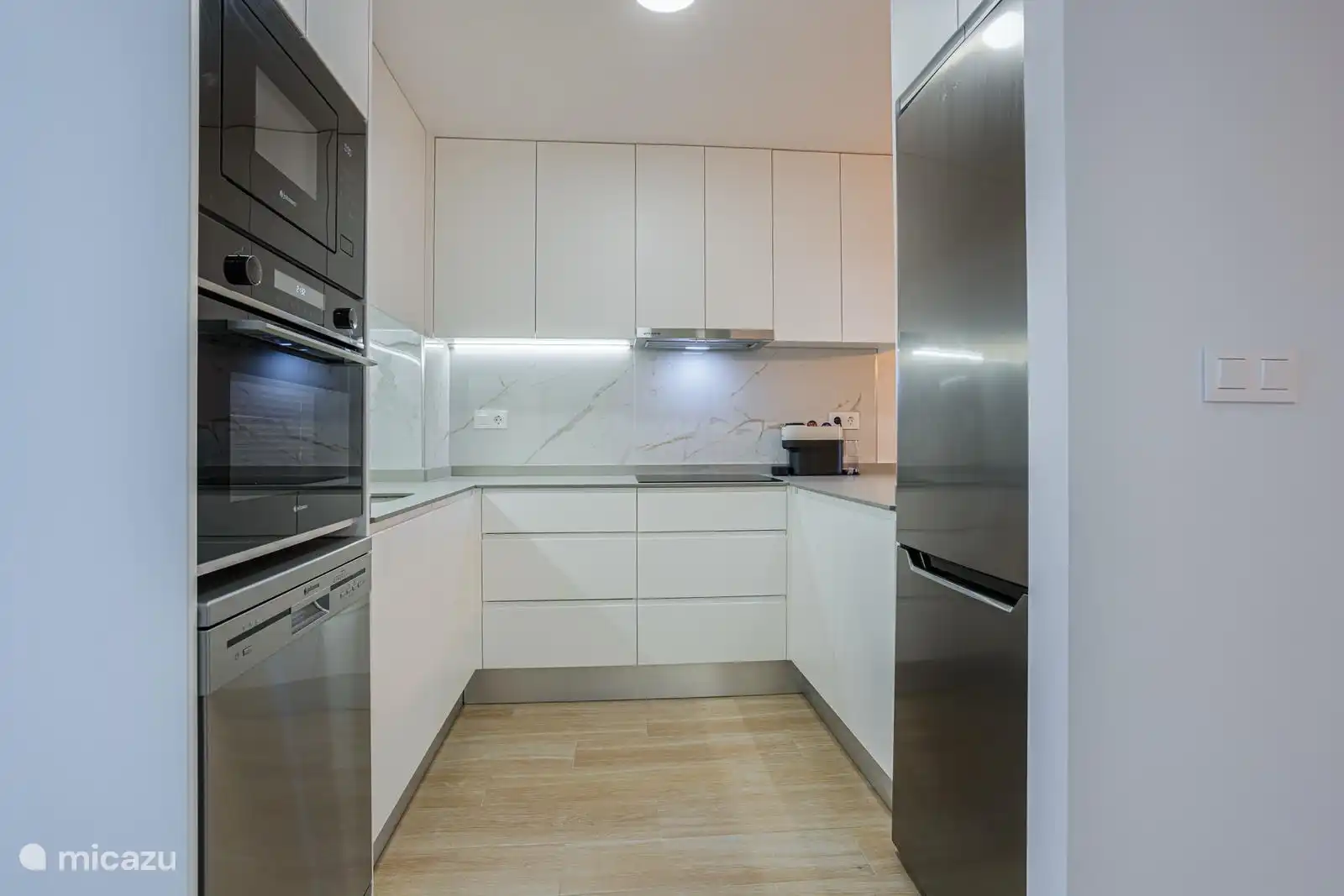 The kitchen is brand new! The kitchen is equipped with pans, cutlery, glasses, oven, refrigerator, dishwasher, induction plate, coffee maker and freezer. 