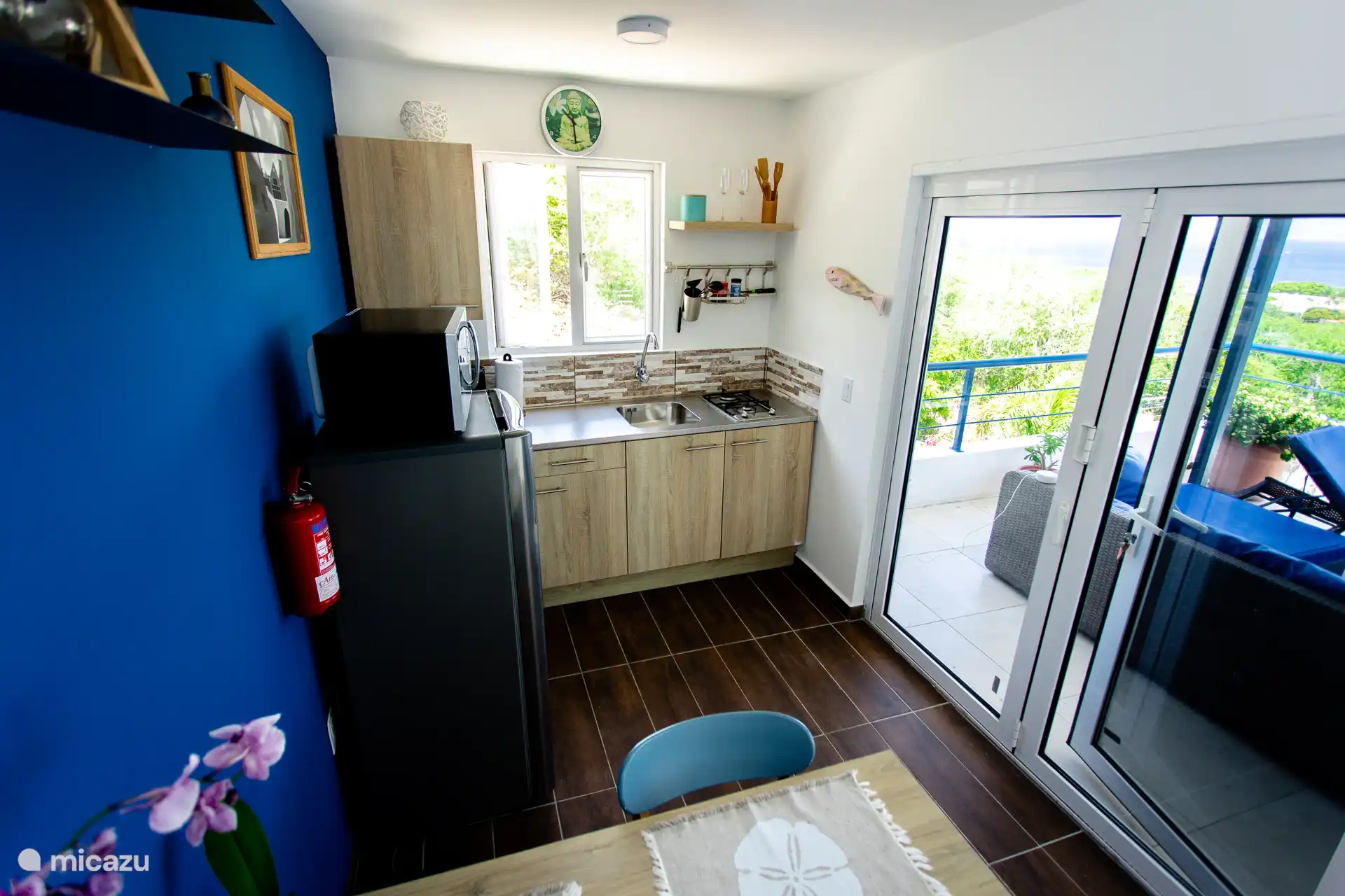 Bright and minimal dining area next to the sliding doors — perfect for meals or working remotely.