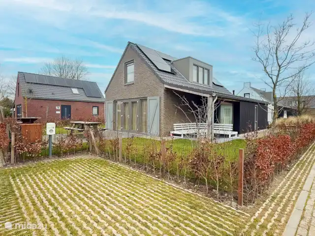 À l’extérieur au bord de la mer | Pays-Bas, Hollande du Nord, Saint Martin - maison de vacances Maison de vacances à l’arrière - jardin entièrement clos
Place de parking privée avec station de recharge