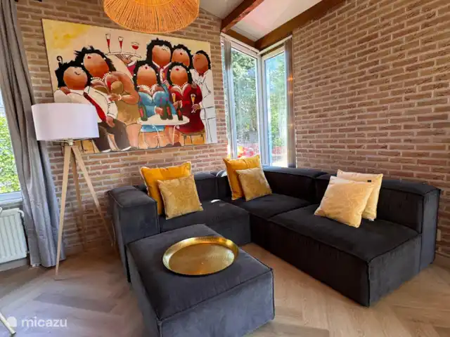 Villa Frans | Pays-Bas, Zélande, Renesse - maison de vacances Salon plein d’atmosphère et de lumière, avec vue sur le jardin. Ouvrez les portes et laissez la Zélande entrer !