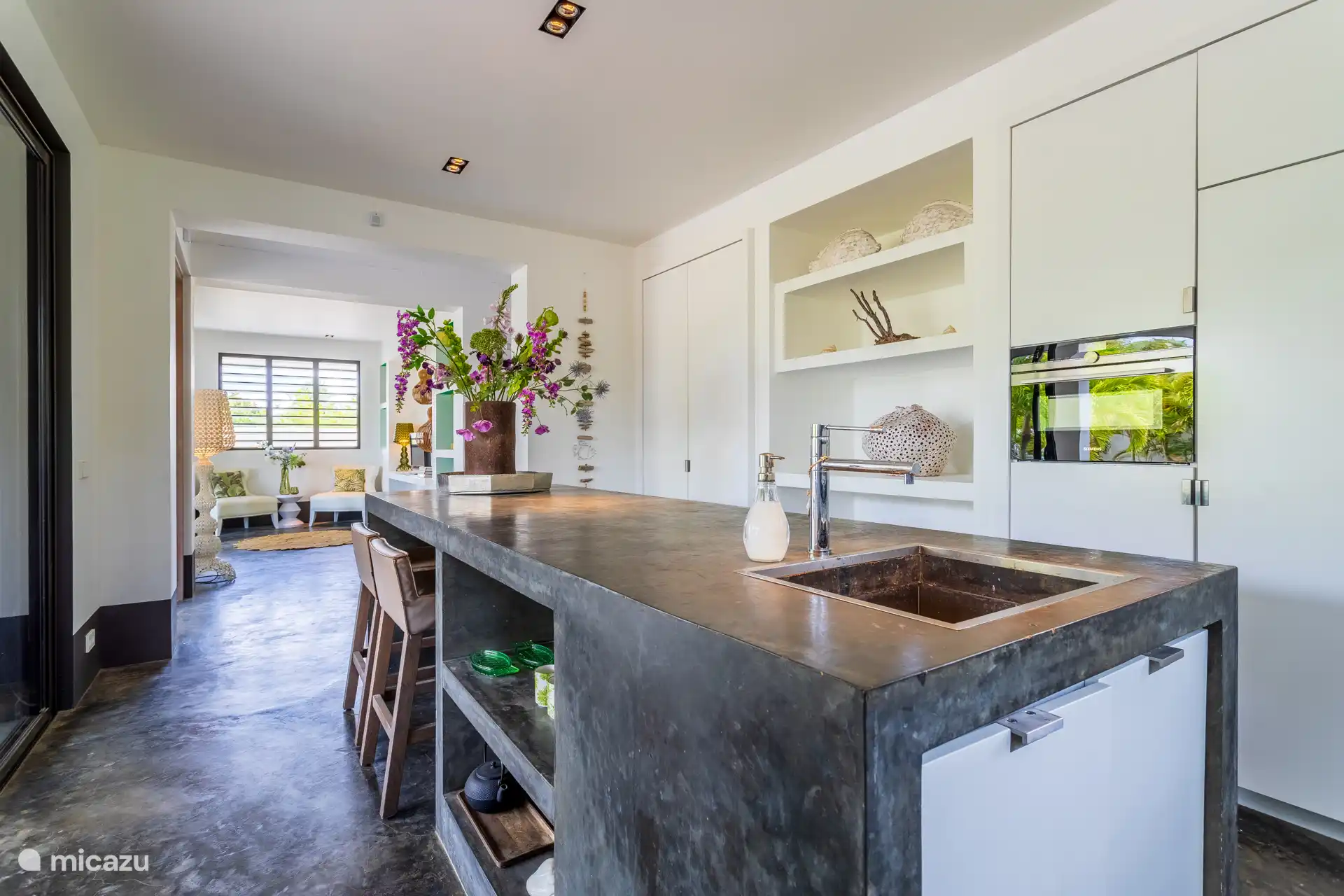 The spacious kitchen island is also ideal for working on or having a quick breakfast.