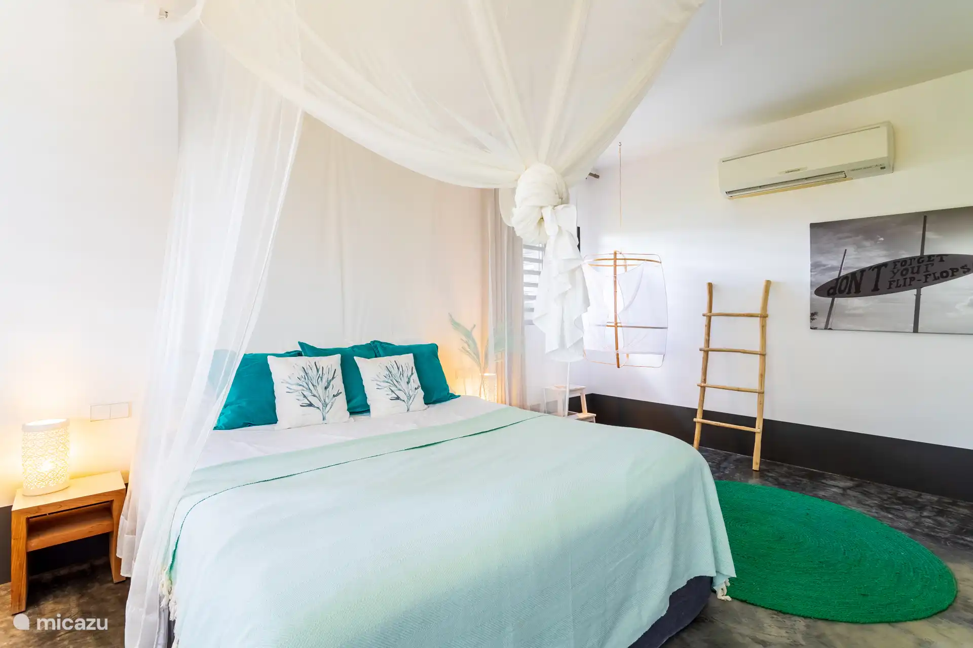 The second bedroom has a king-size bed with mosquito net and with a seat, sufficient closet space and AC. 