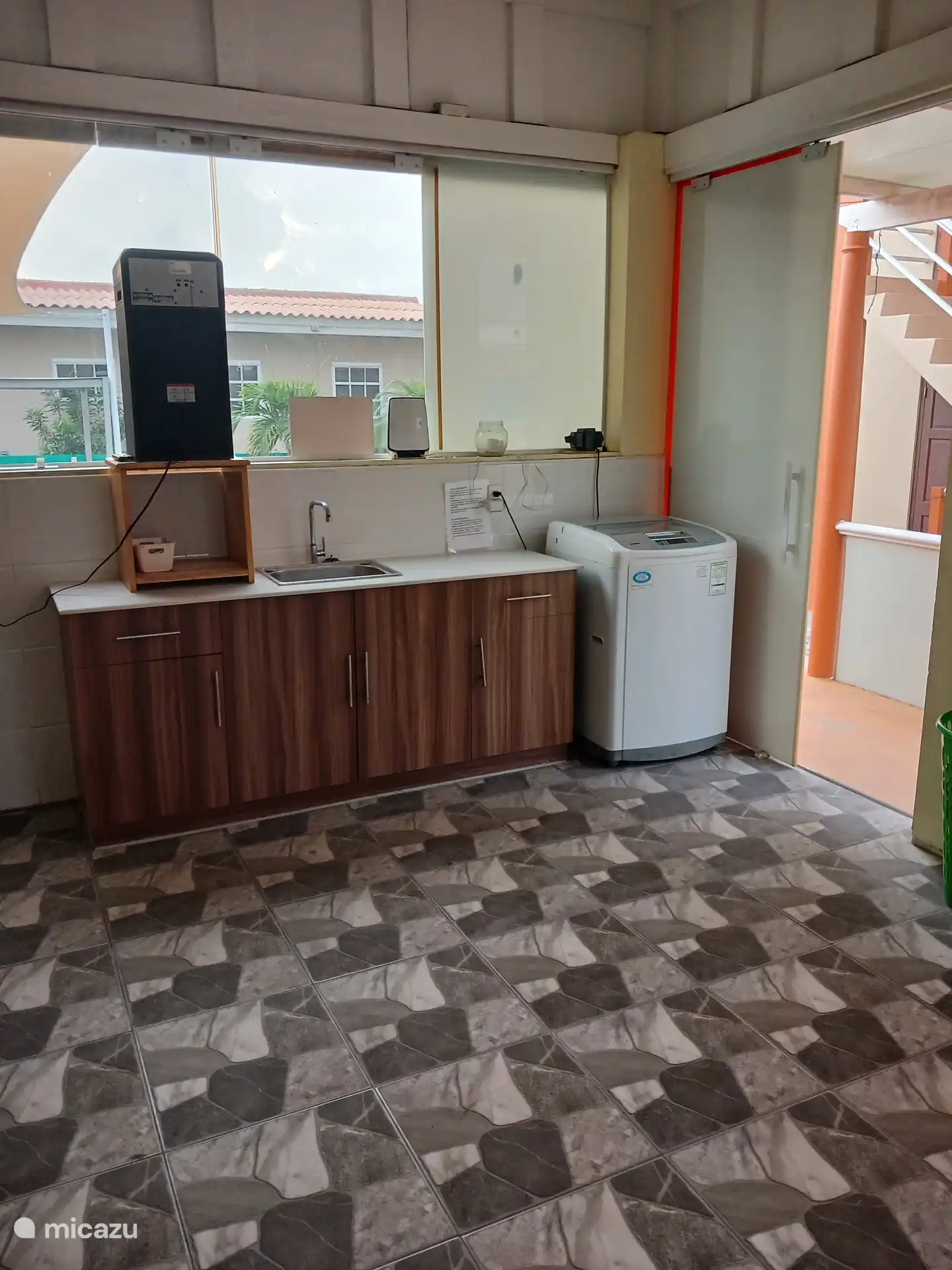 Laundry room with toilet 