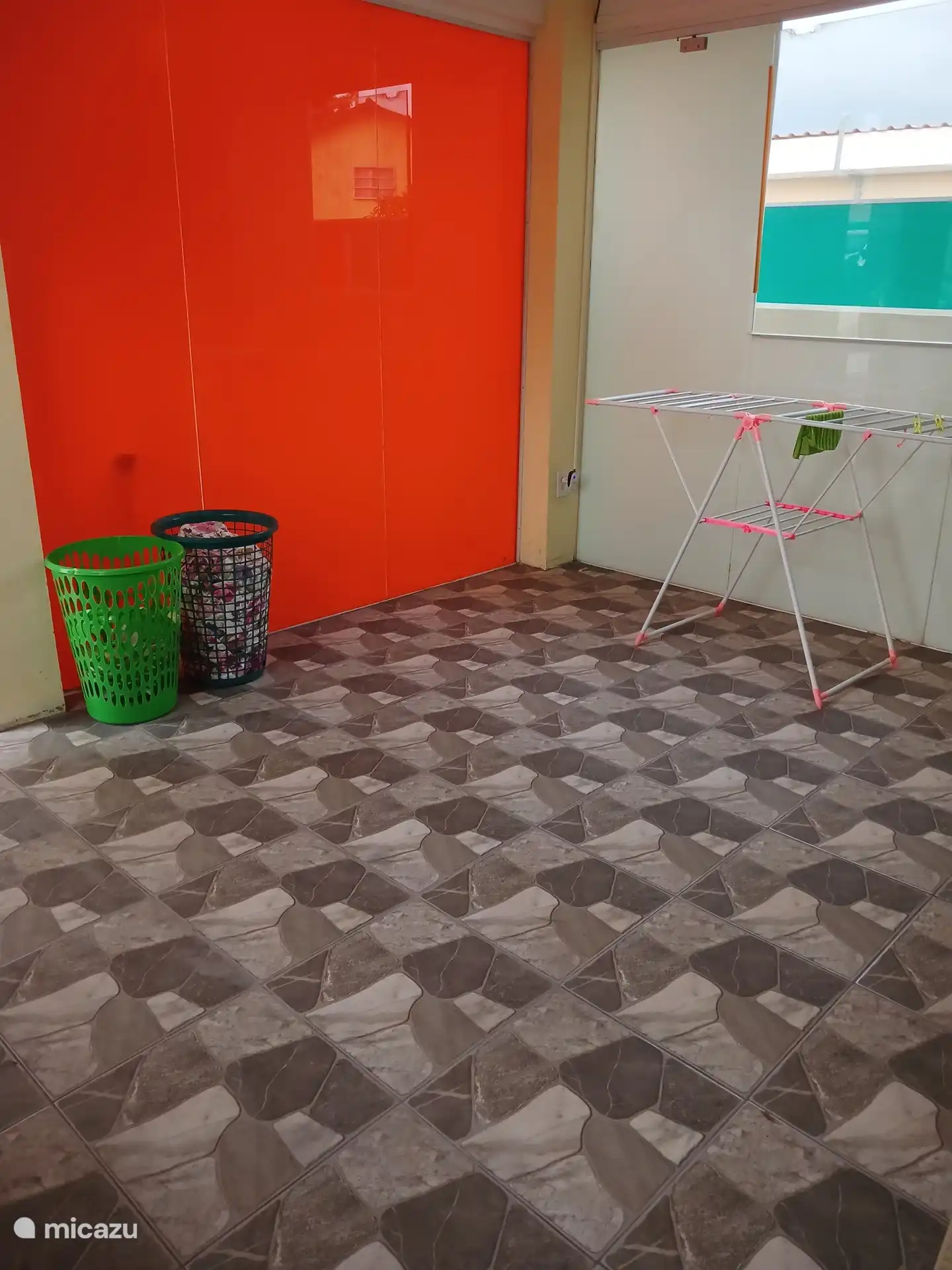There is also a laundry room in the building next to the swimming pool with washing machine, iron and ironing board, there is also a toilet
