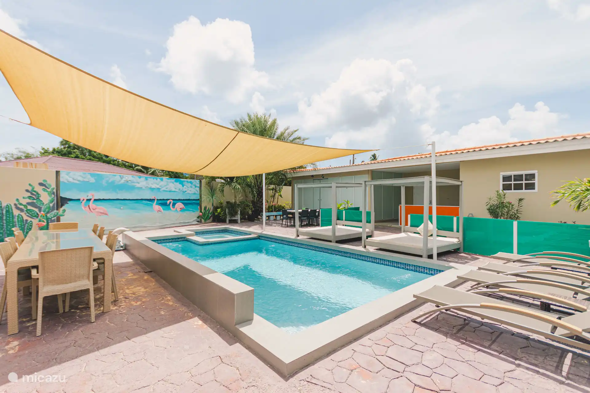 Swimming pool with sunbeds and beach chairs to relax quietly