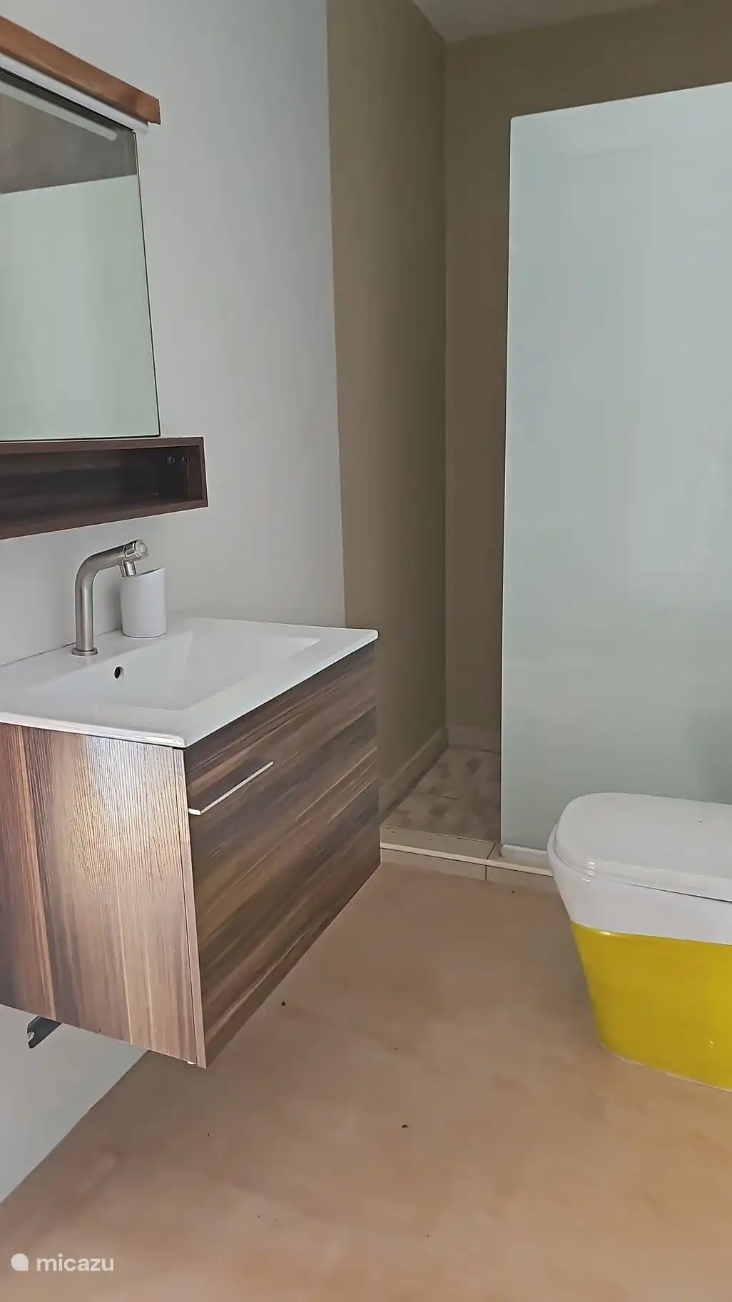 Shower is equipped with hot water.