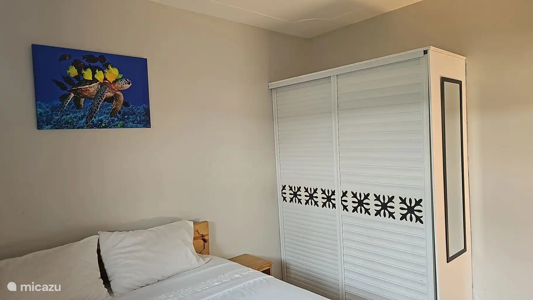 For storing clothes is a closet with clothes hangers
