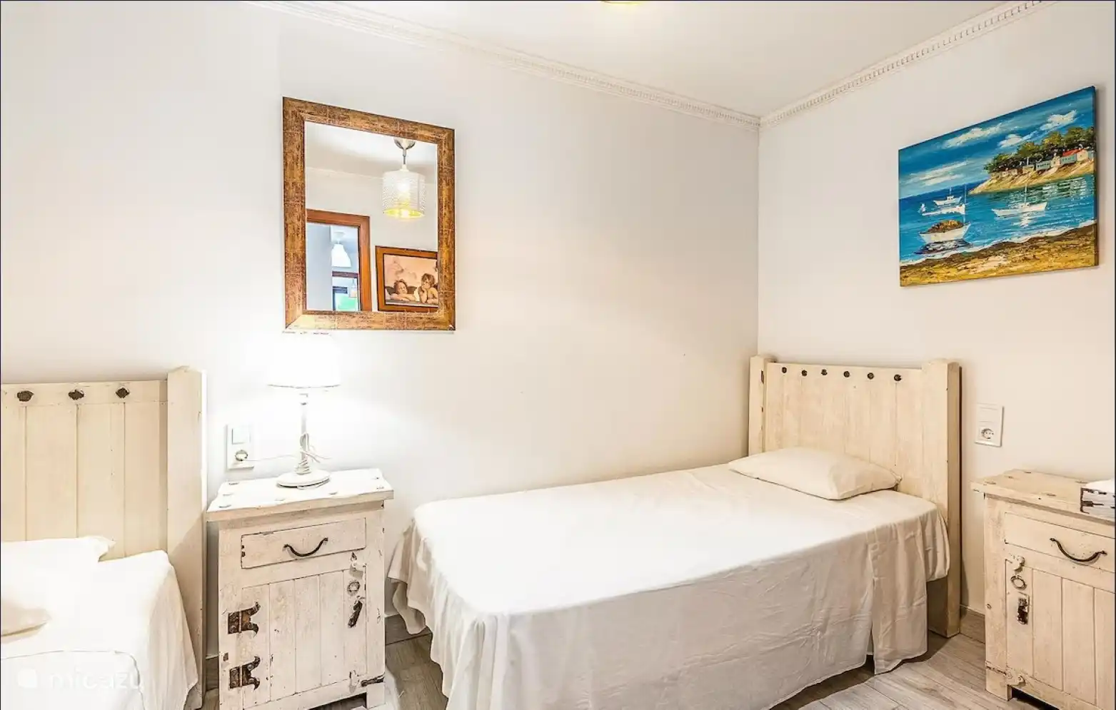 ground floor bedroom with single beds and a double sofa bed