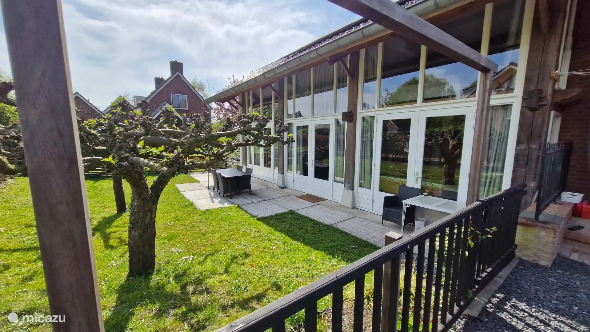 In the (enclosed) garden is a terrace with table, chairs, a parasol and a BBQ (own coal please).