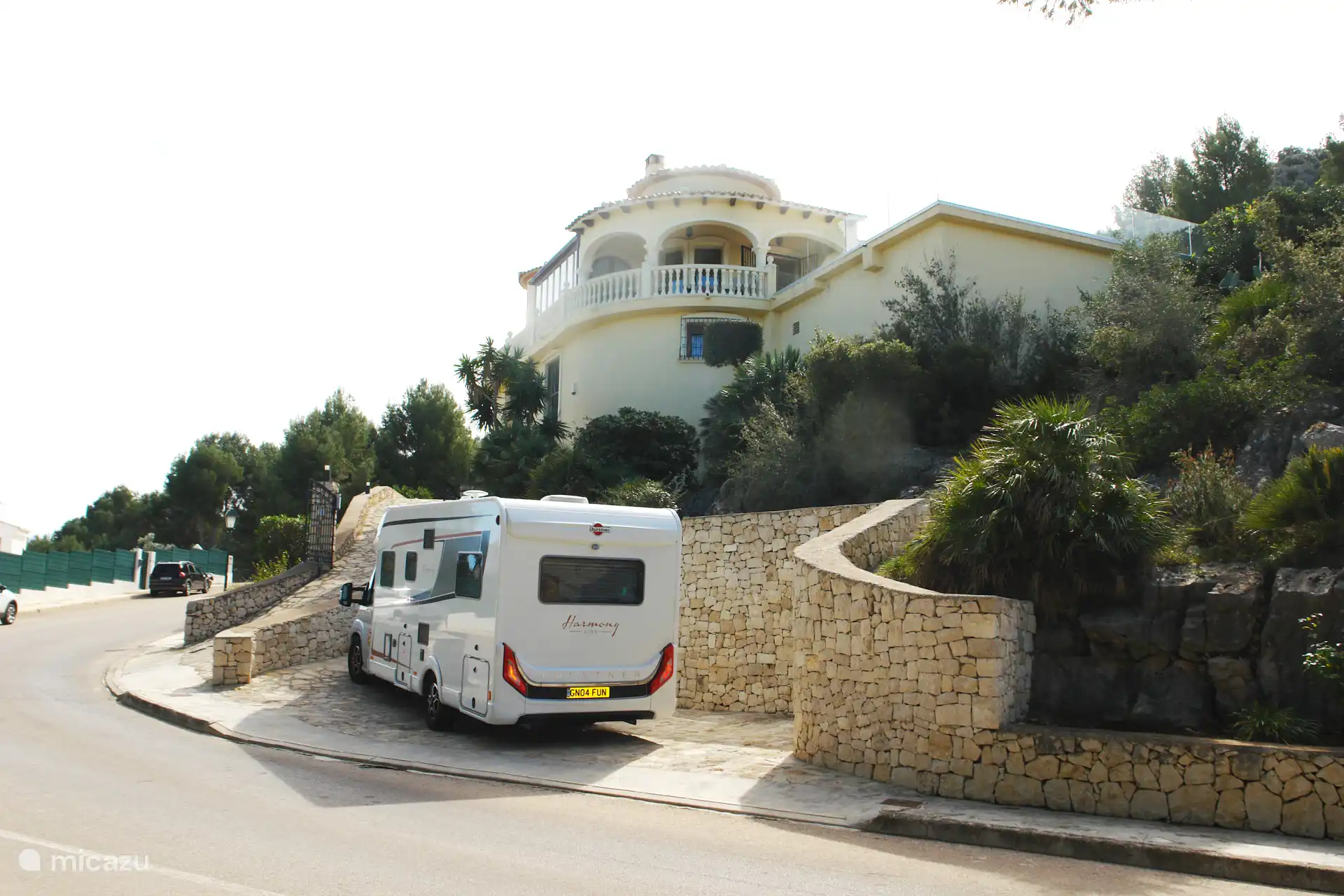 Parking space with charging station at street level.