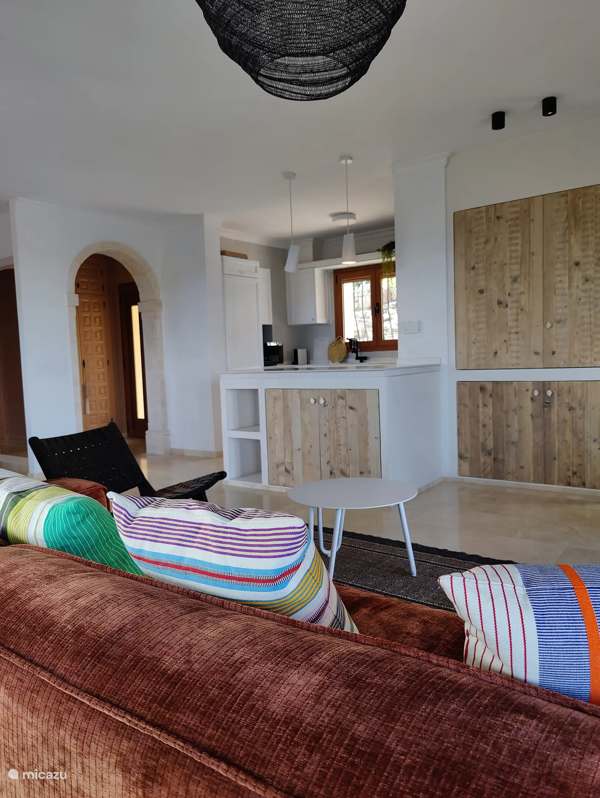 Living room with a view of the open kitchen.