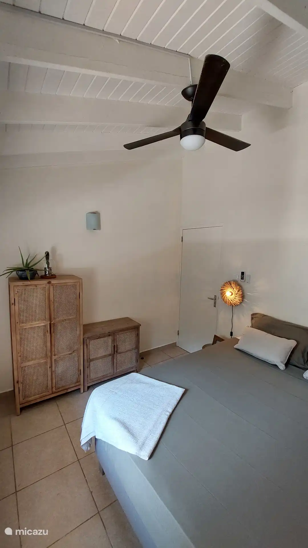 Bedroom with air conditioning and fan
