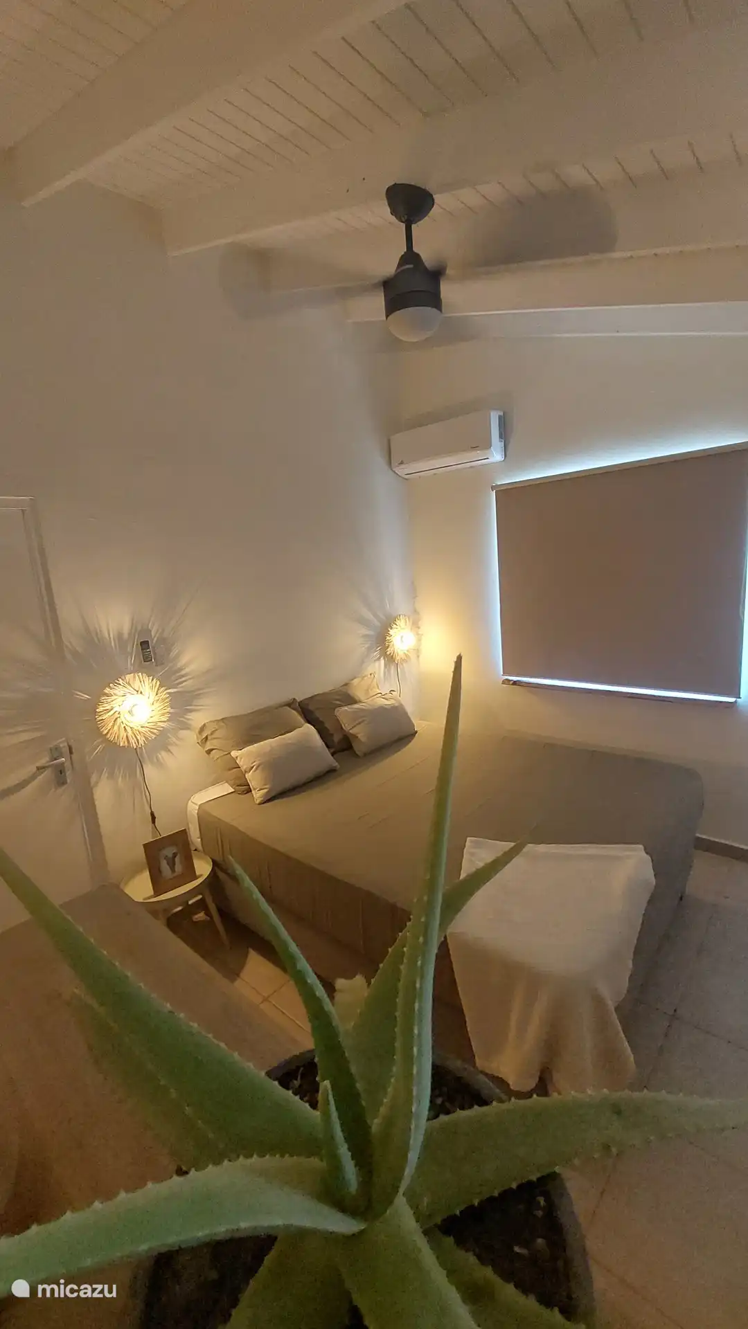 Bedroom with air conditioning and fan