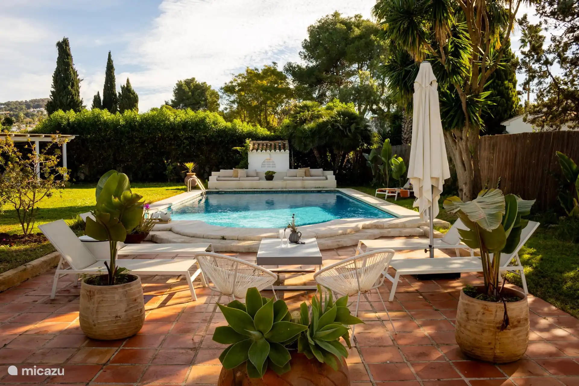 The lovely large swimming pool with a large lounger at the end to relax for hours. A place for everyone.