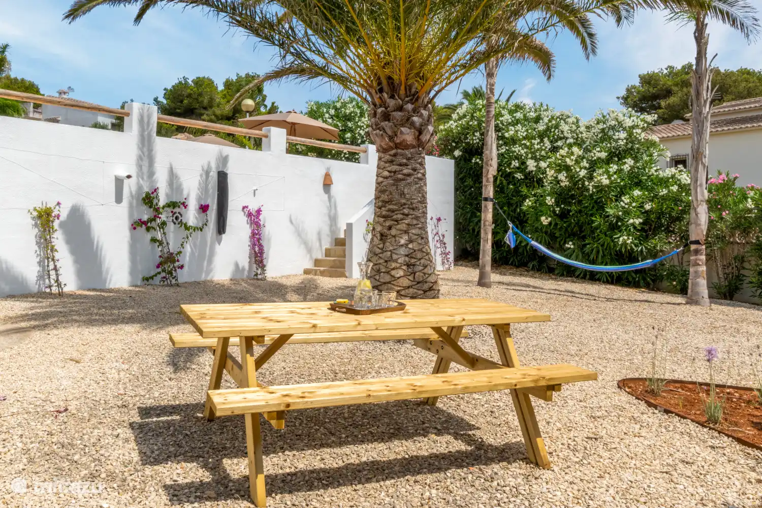 Picnic table and hammock downstairs in garden