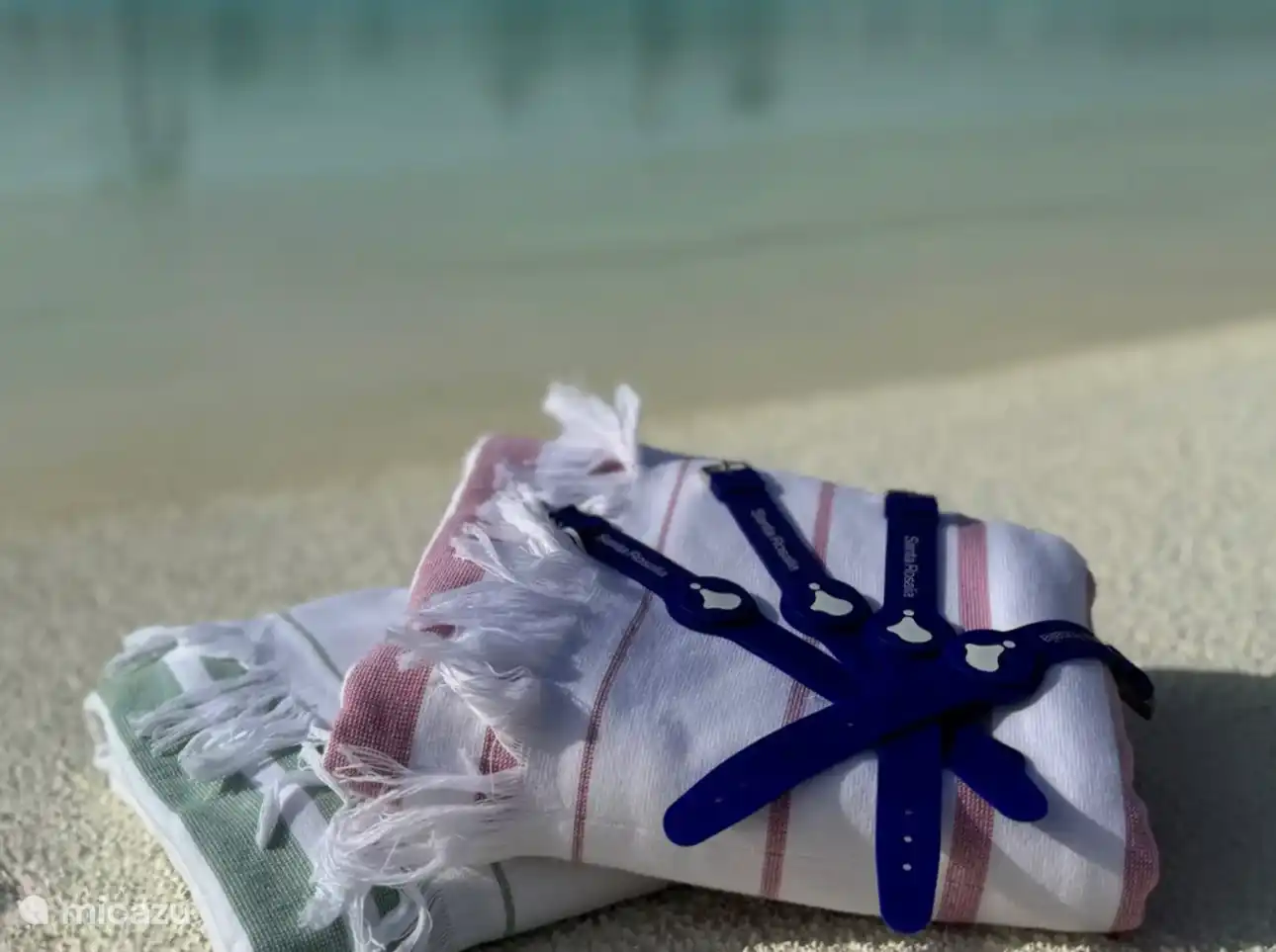 Nuestras deliciosas toallas de playa y pulseras de acceso para nuestros huéspedes