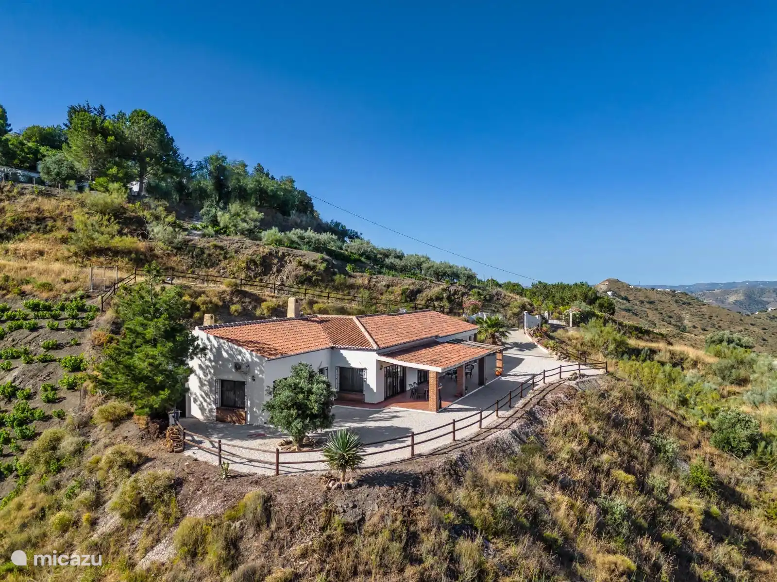 View of the mountains and the sea in the distance.