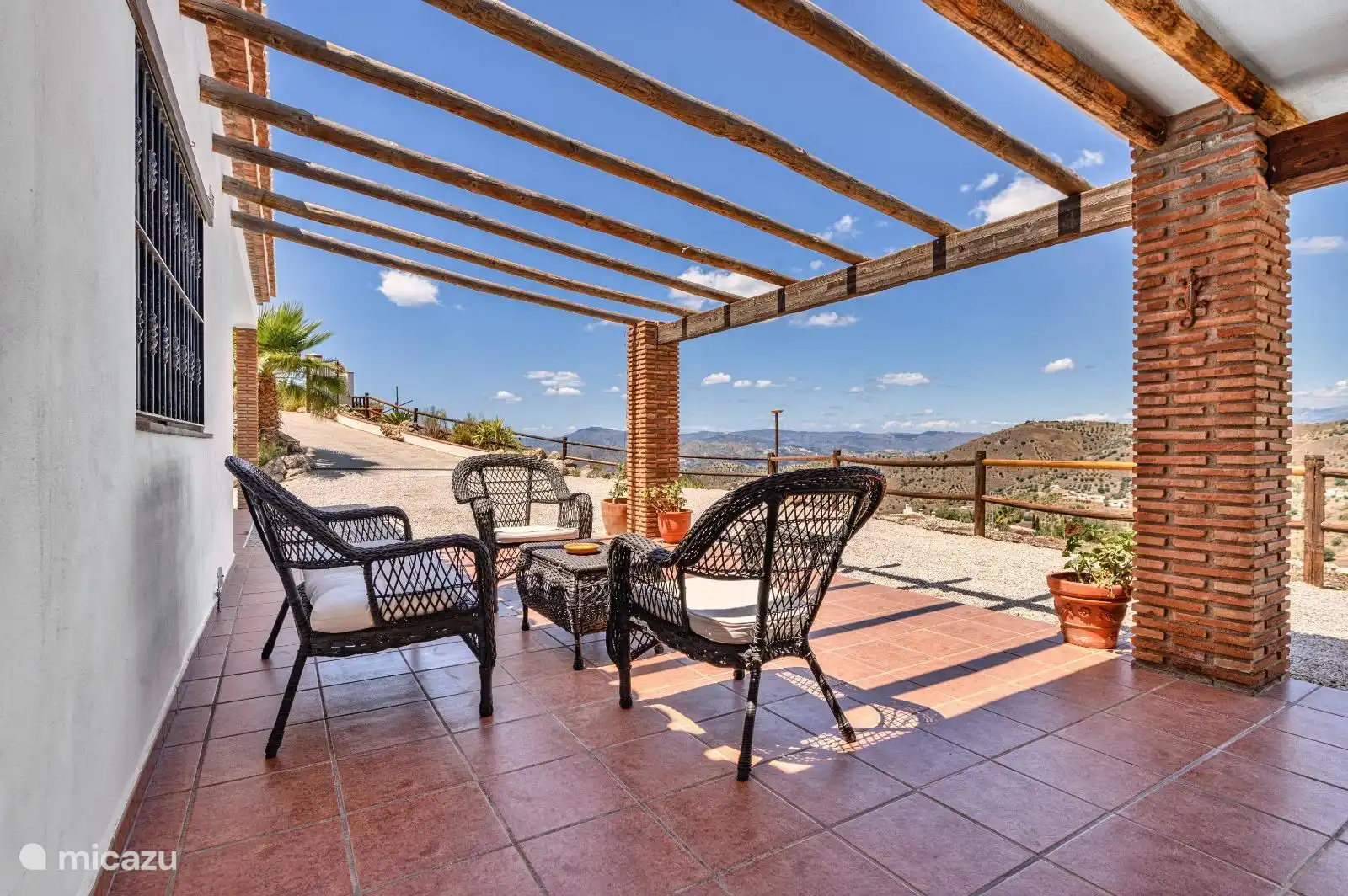 Terrace at the front of the villa with both a covered and uncovered part
