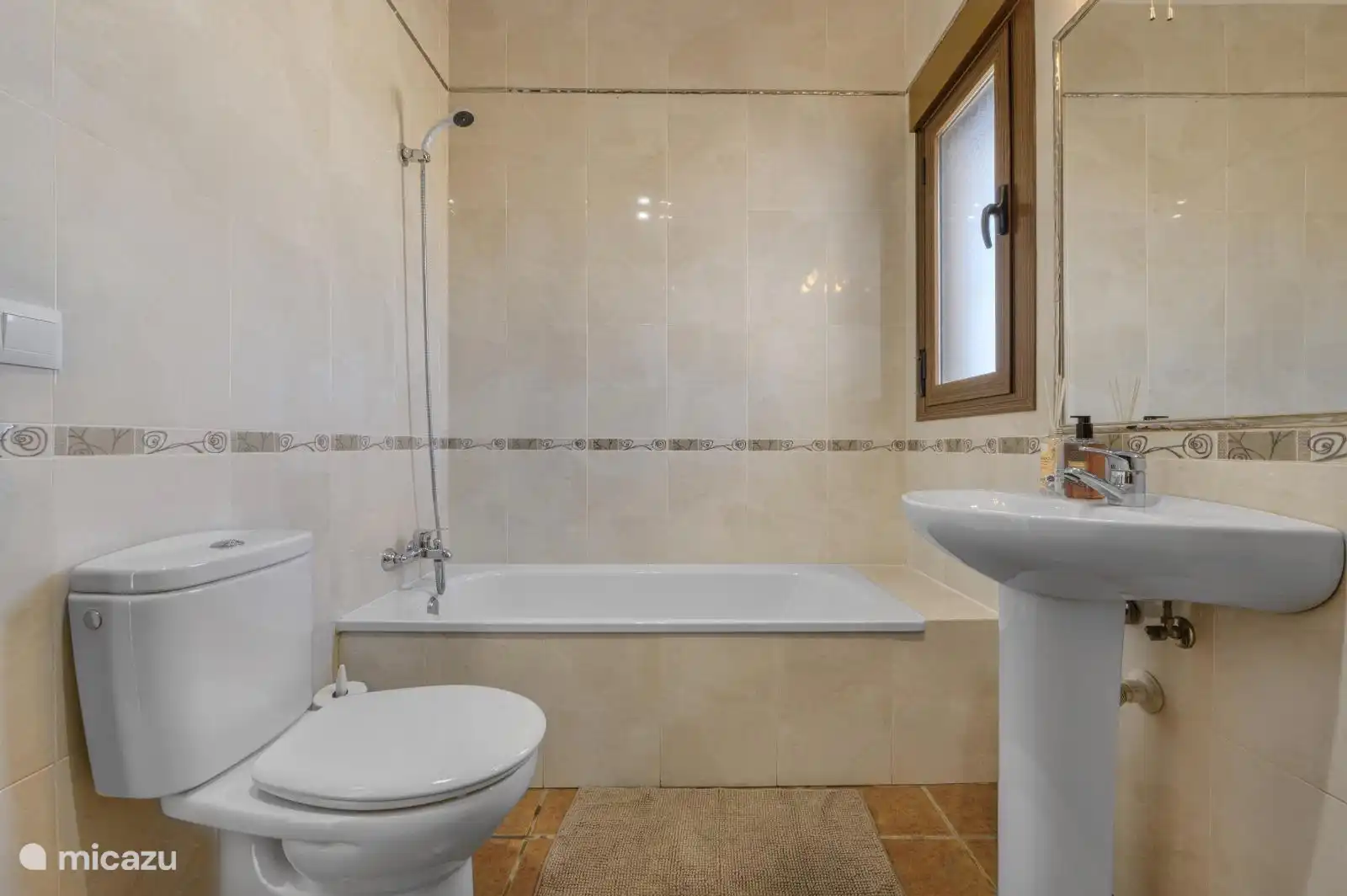 Bathroom 1 with bath, shower and toilet