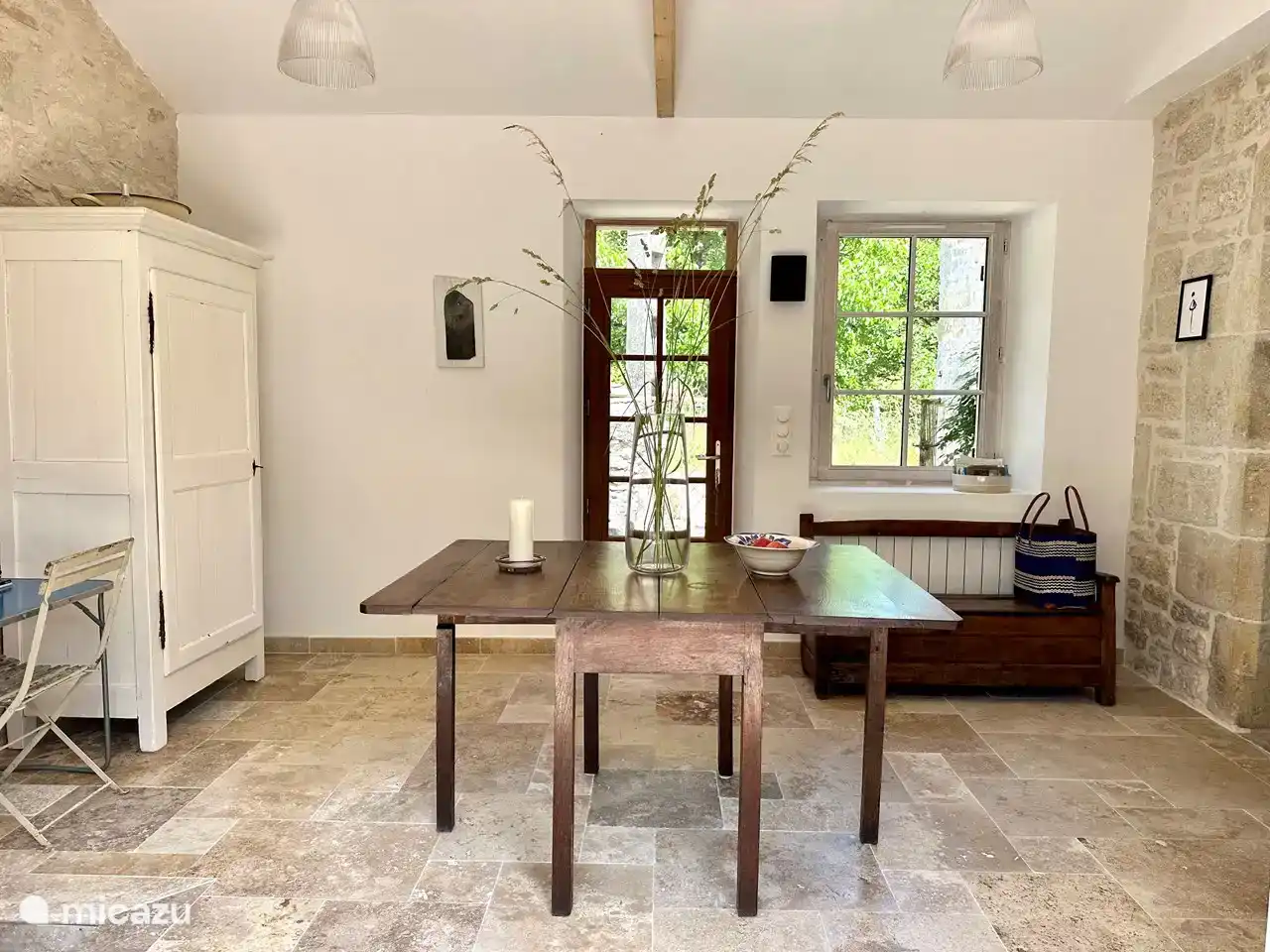 The front door, seen from the hall, with the French doors in the back.