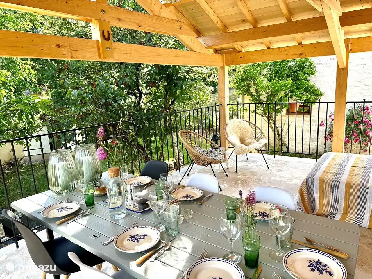 The dining table, set, on the terrace near the living room/kitchen. The ideal place for coffee, breakfast, drinks and dinner.