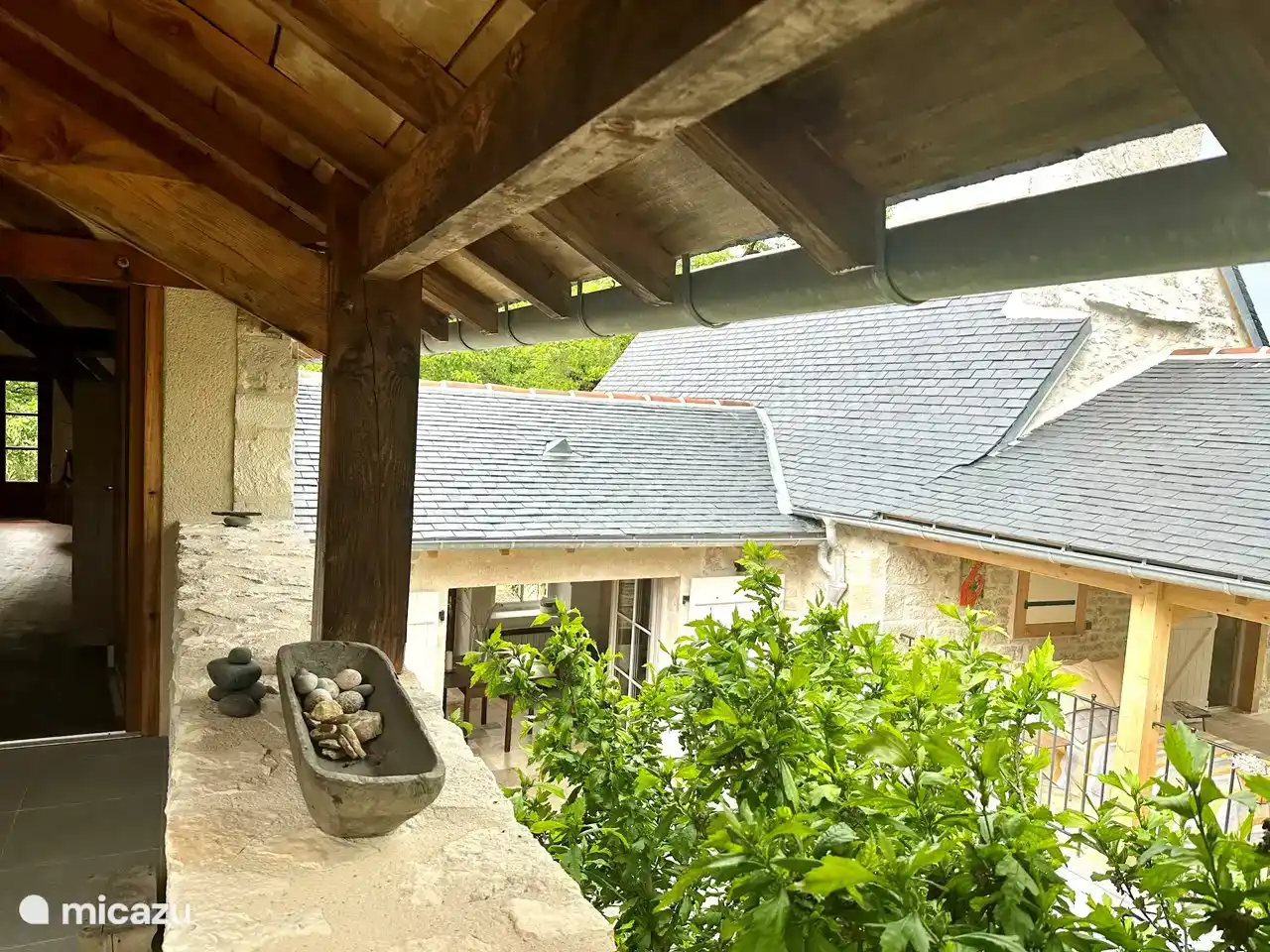 View from the terrace to the main bedroom upstairs. It is wonderful to sleep under the mosquito net and wake up to the sound of many birds.