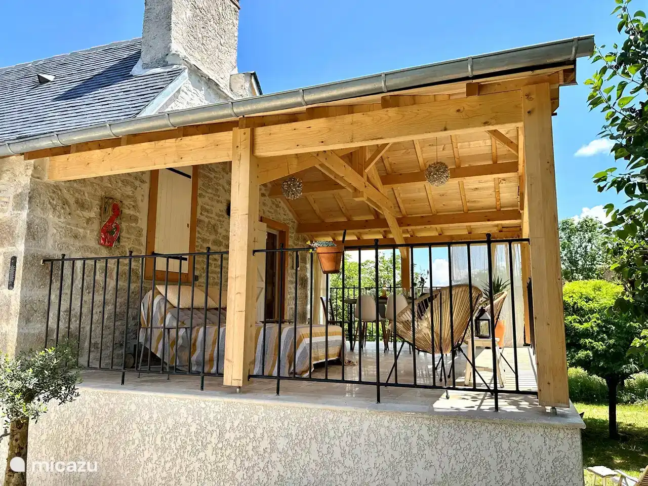 The house is almost entirely on 1 level, because the ground slopes. On this side is the terrace off the living room just above the ground, the other side is higher with beautiful views of the garden. 