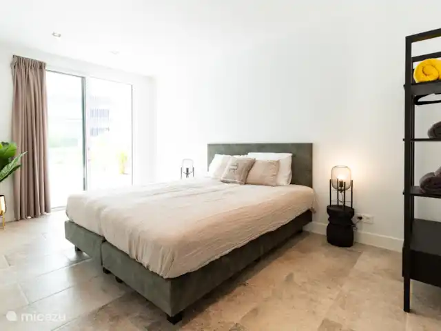 Location de Vacances Curaçao, Banda Ariba (est), Bapor Kibra, appartement - Appartement de luxe avec piscine à Mambo Beach  La chambre 2 dispose d’un lit king-size et, en option, d’un lit pliant pour 1 personne.