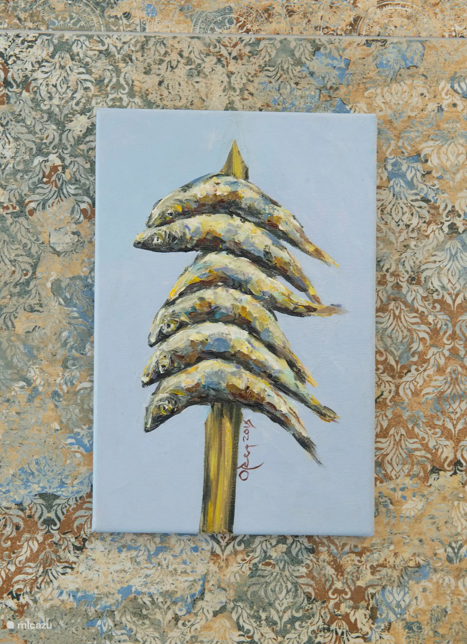 Málaga ist berühmt für seine Espetos, frische Sardinen, die über offenem Feuer gegrillt werden. Dieses Gemälde wurde von einem lokalen Künstler angefertigt. 