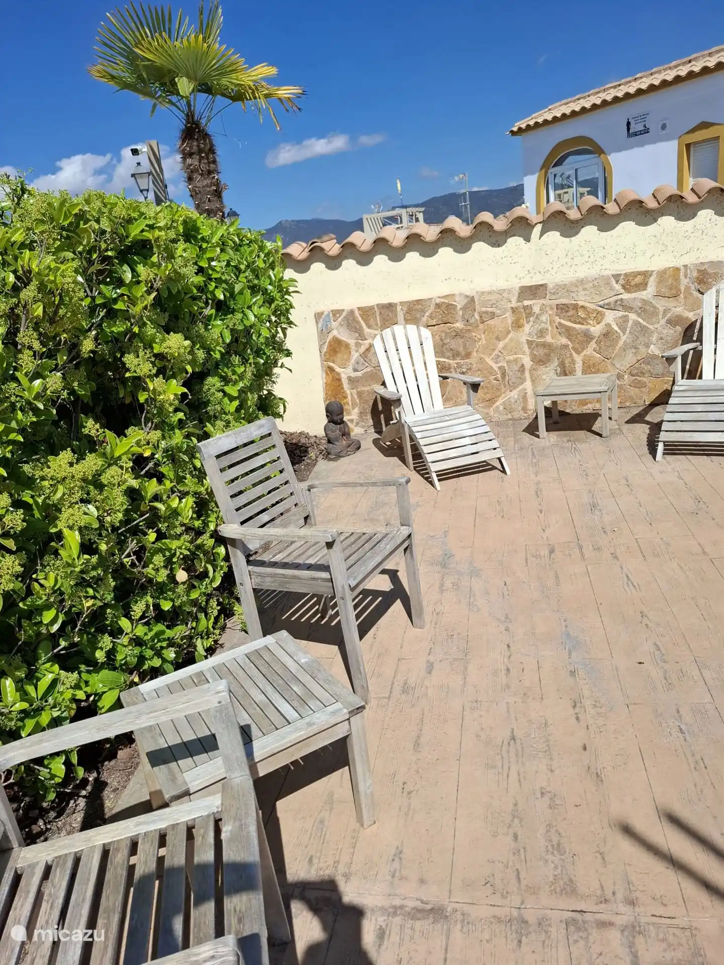 Outdoor furniture at the front of the pool