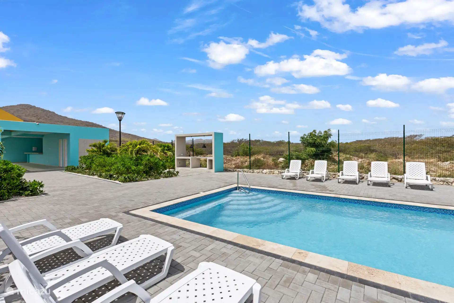 Enjoy a refreshing swim with a direct view of the blue sea.