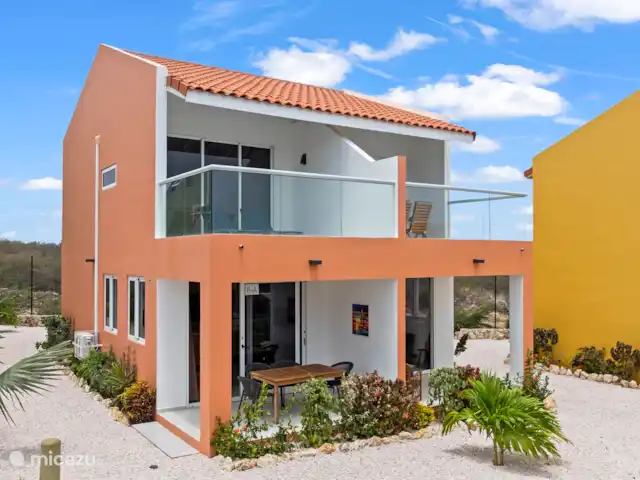 Punta Azul Ocean Resort 6A | Curaçao, Banda Abou (ouest), Westpunt - maison de vacances Maison orange caractéristique avec un aspect chaleureux.