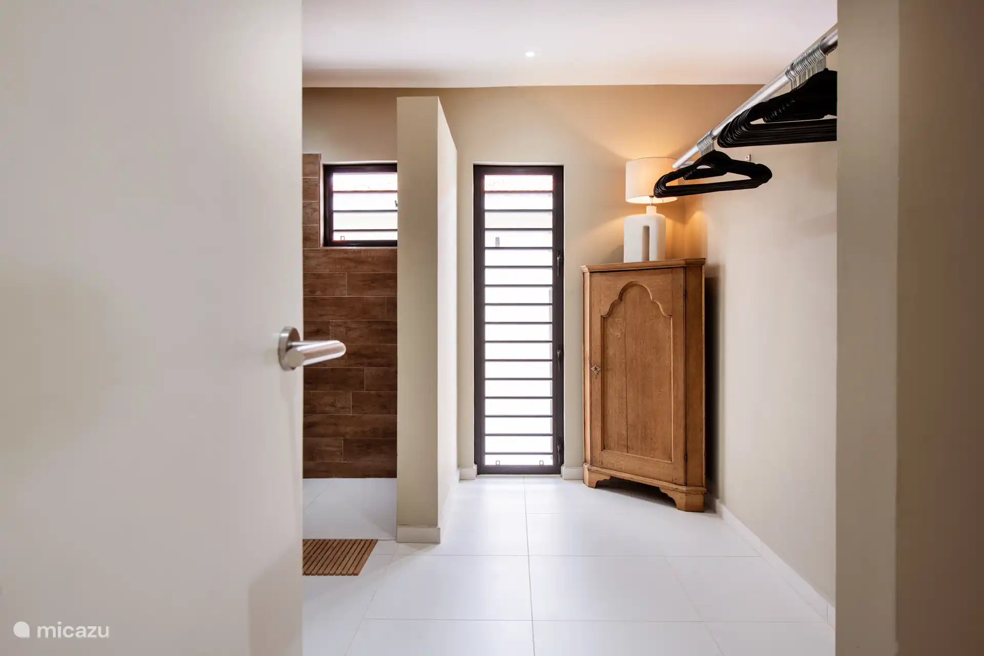 The open walk-in closet of the second bedroom, plenty of space!